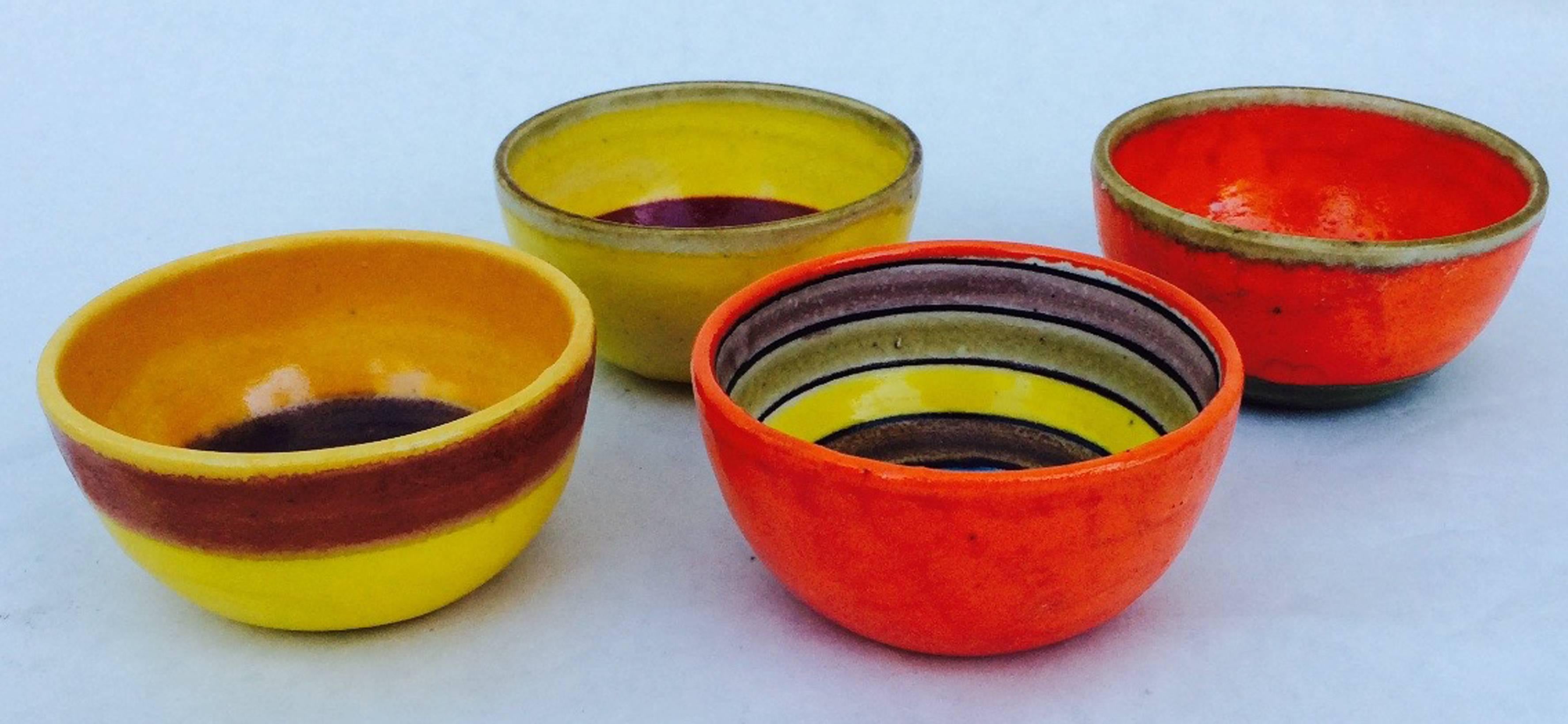 A vibrant set of four Bruno Gambone bowls for Illums Bolighus. Signed items retain original stickers. Pristine with no issues.