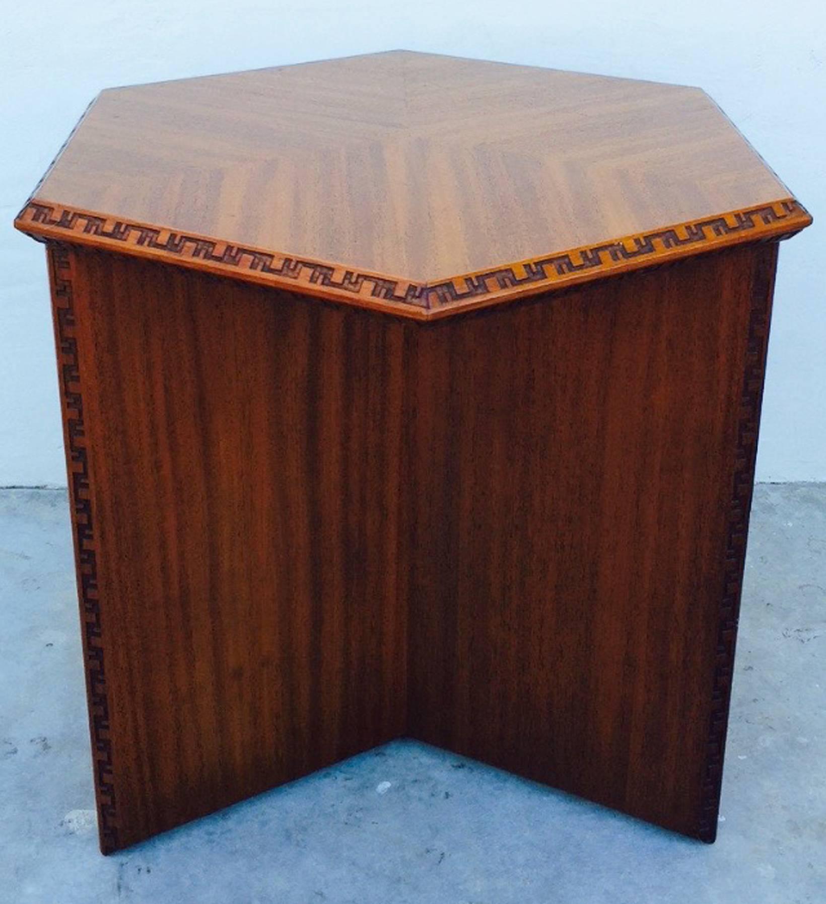 A fine Frank Lloyd Wright Taliesin cocktail table. Signed mahogany item for Heritage-Henredon, 1955. Item features carved 