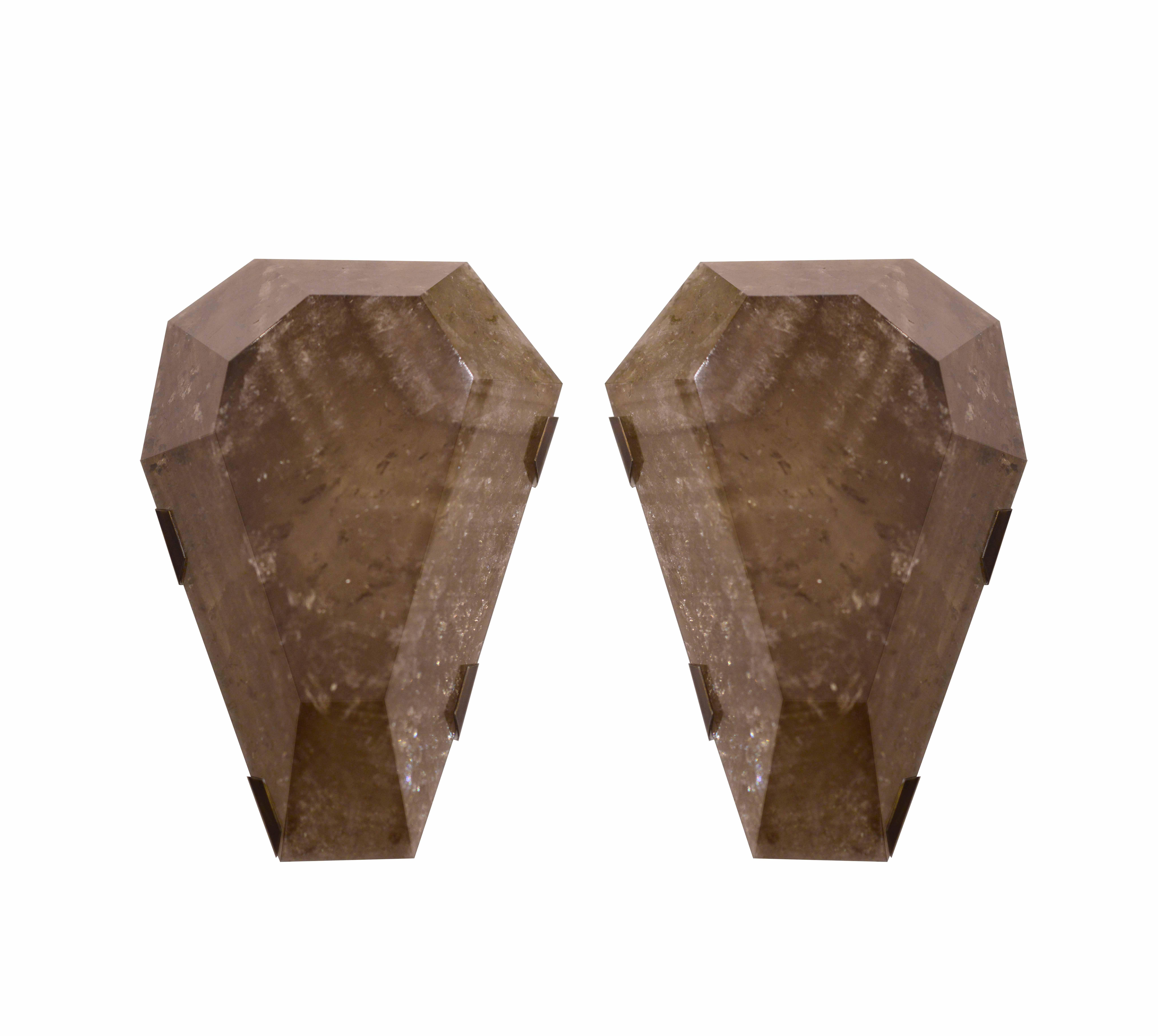 Pair of fine carved diamond form smoky brown rock crystal sconces with antique brass mount, created by Phoenix Gallery, NYC.
Each sconce has two sockets with candle light bulbs max of 120W.
Custom measurement and finish available. 
15 in/H x 11 in/W
