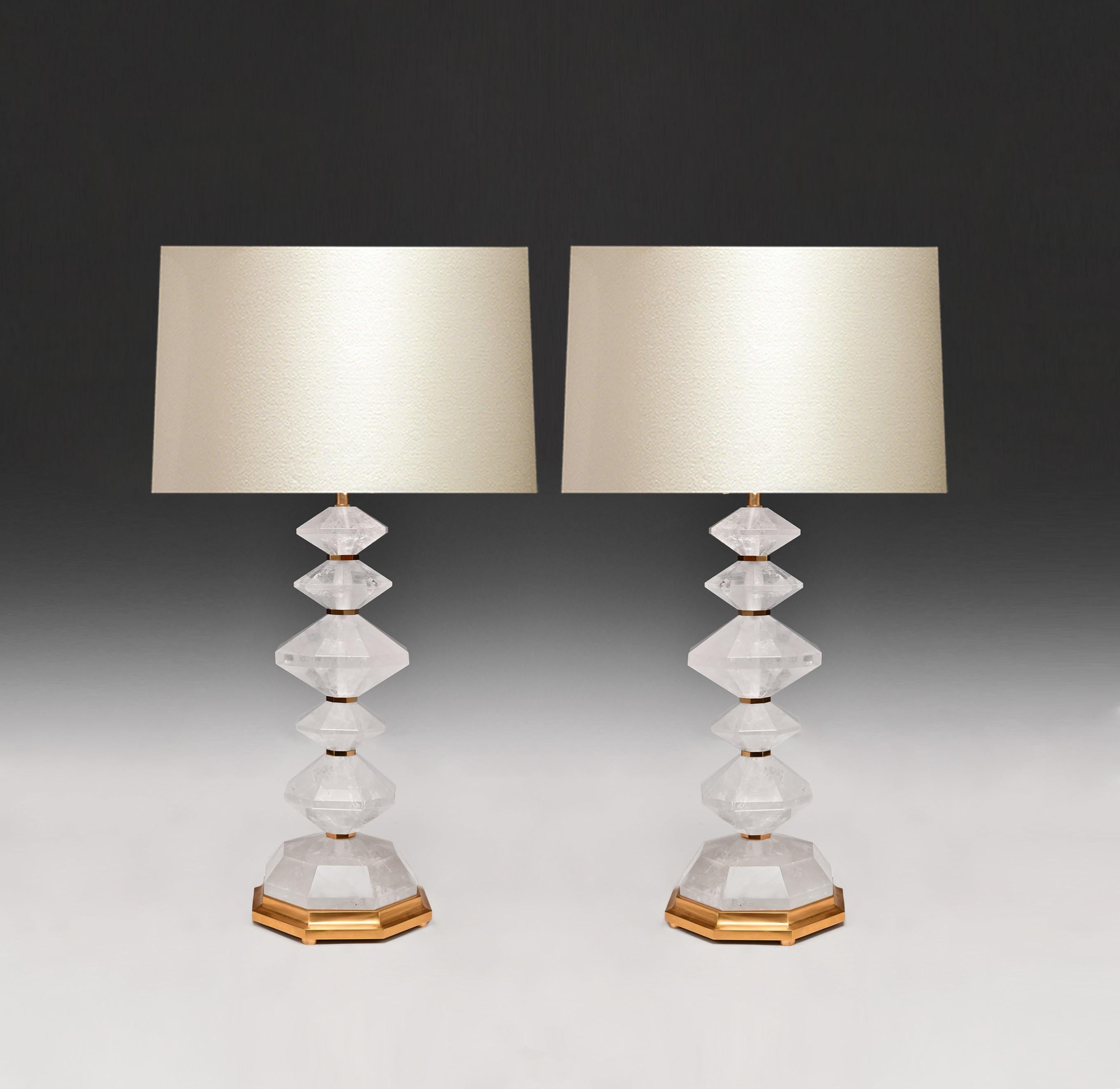 A pair of carved diamond rock crystal lamps with polish brass decoration. Created by Phoenix Gallery, NYC.
Custom size and quantity upon request.
To the rock crystal: 19.25 in/H.
(Lampshade not included).