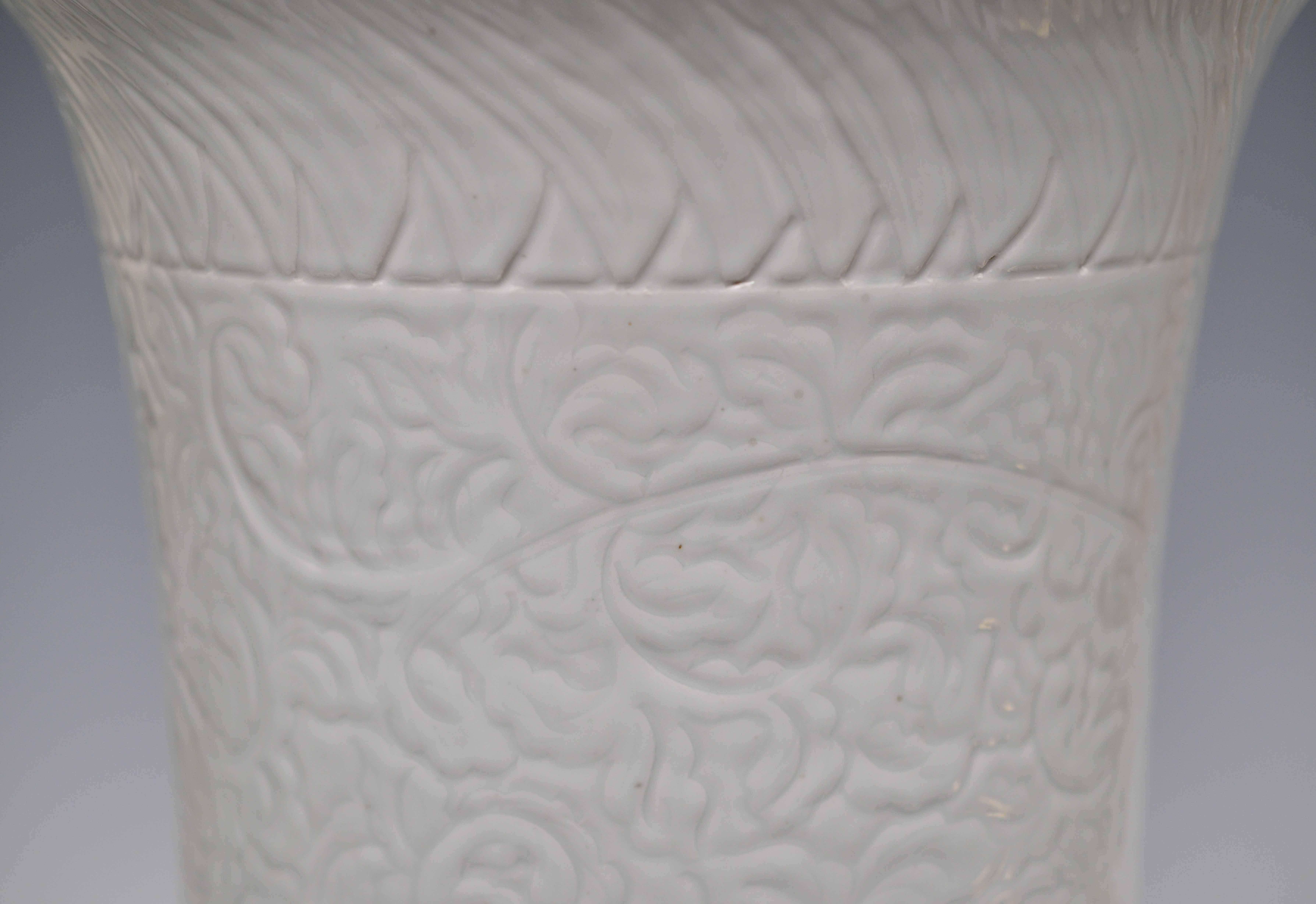 Unique cylindrical form porcelain stools with finely carved with peony stem scroll decorations.