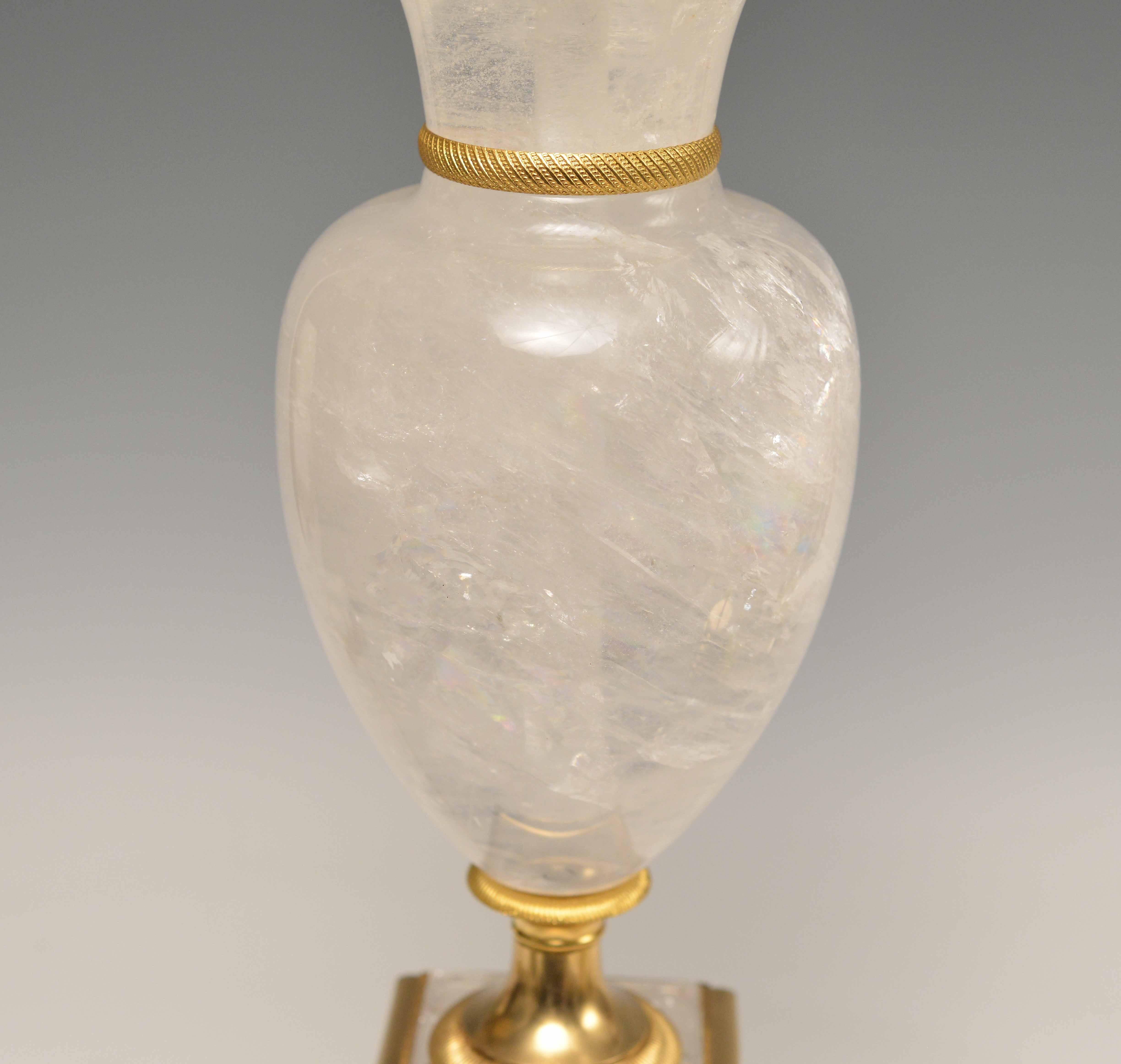 A fine cast polish bronze with carved vase form rock crystal quartz lamp, created by Phoenix Gallery, NYC.
Available in nickel plating and antique brass finished. 
To the rock crystal: 20 inch.
(Lampshade not included)