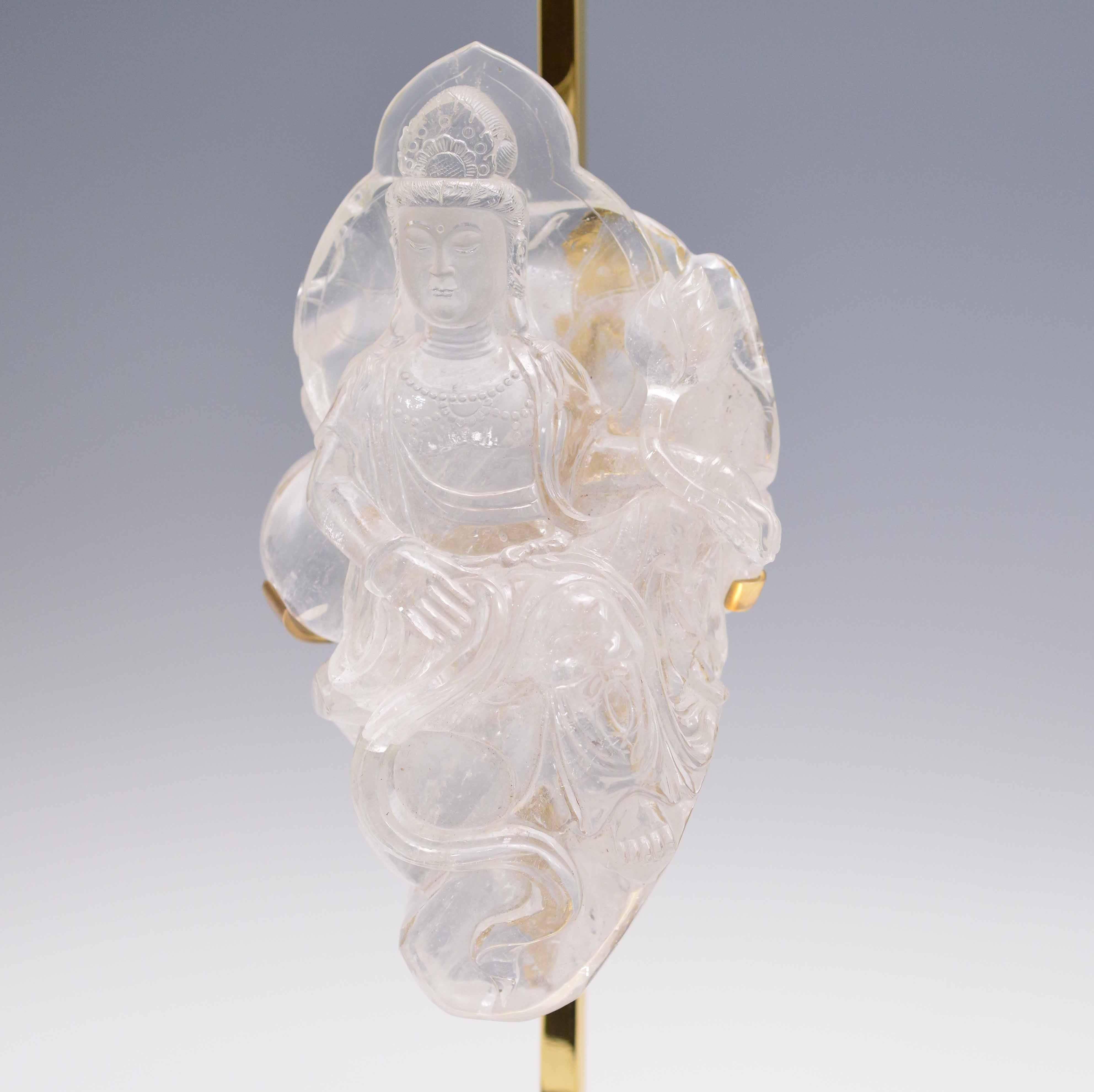 A fine carved rock crystal quartz of Bodhisattva with a lotus flower in custom-made polish brass bases, created by Phoenix Gallery, NYC.
Available in nickel plating and antique brass finished. 
To the rock crystal: 15
