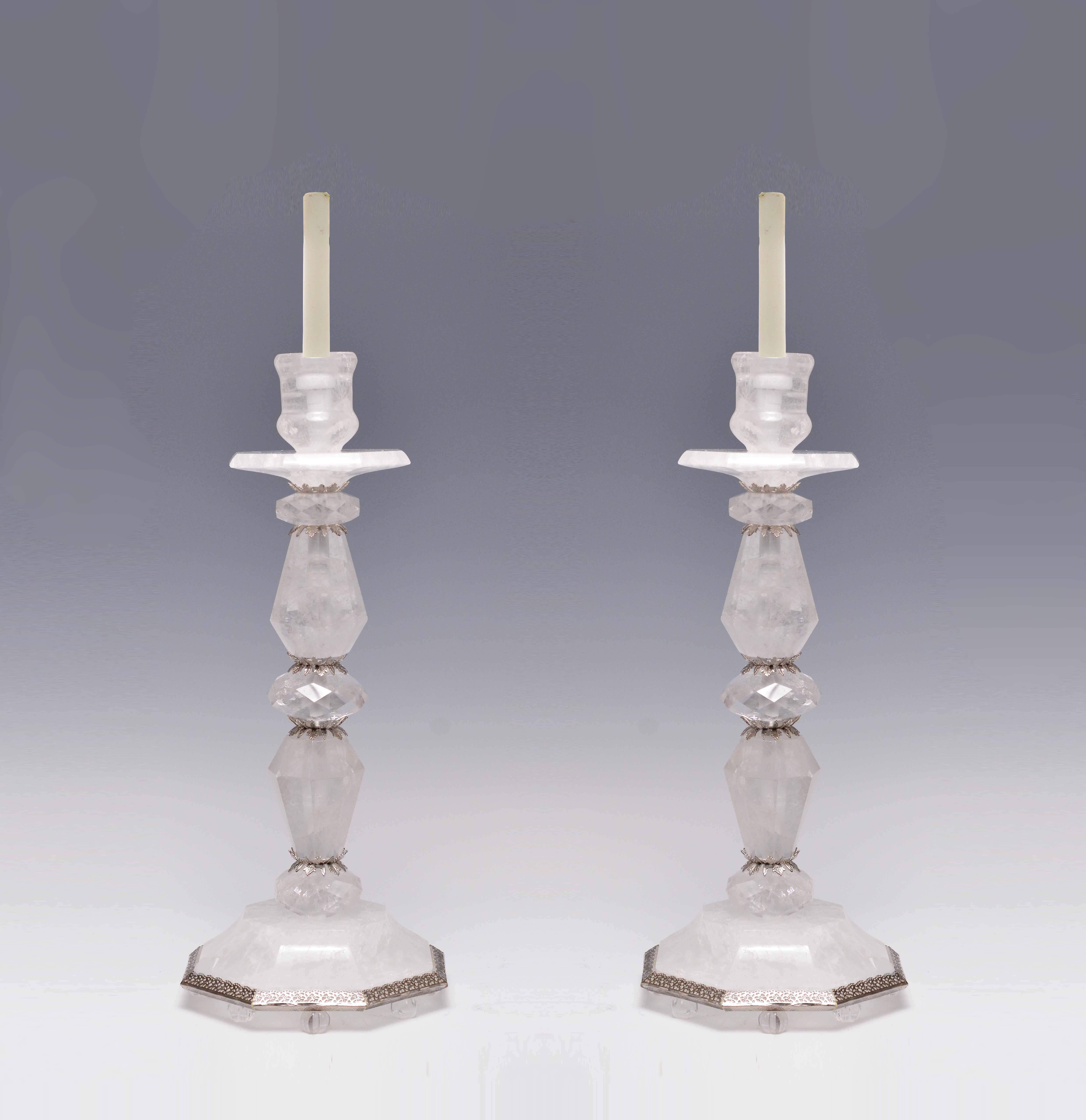 A pair of fine carved rock crystal quartz candle holders.

