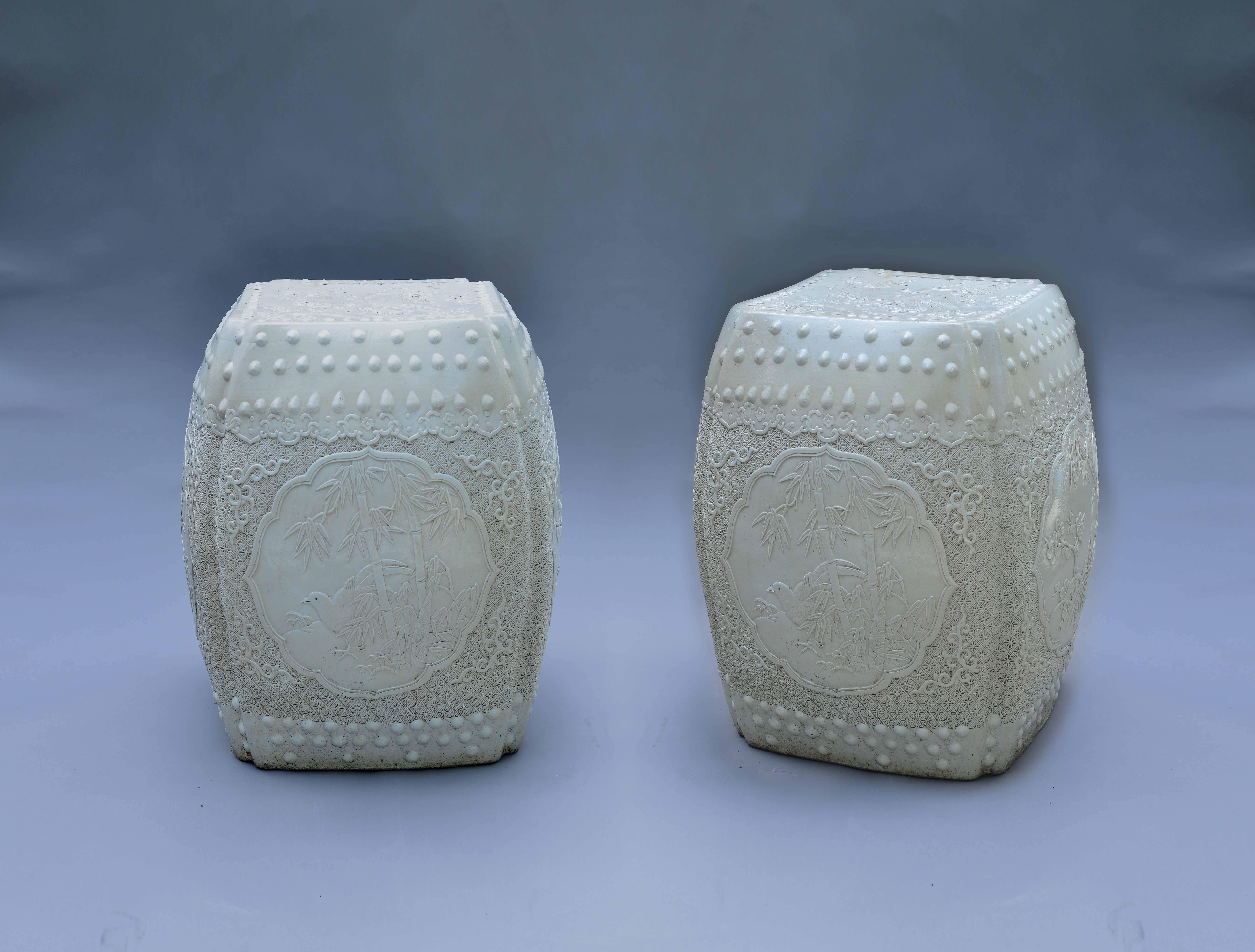 A pair of fine carved porcelain stools with flowers and birds decoration.