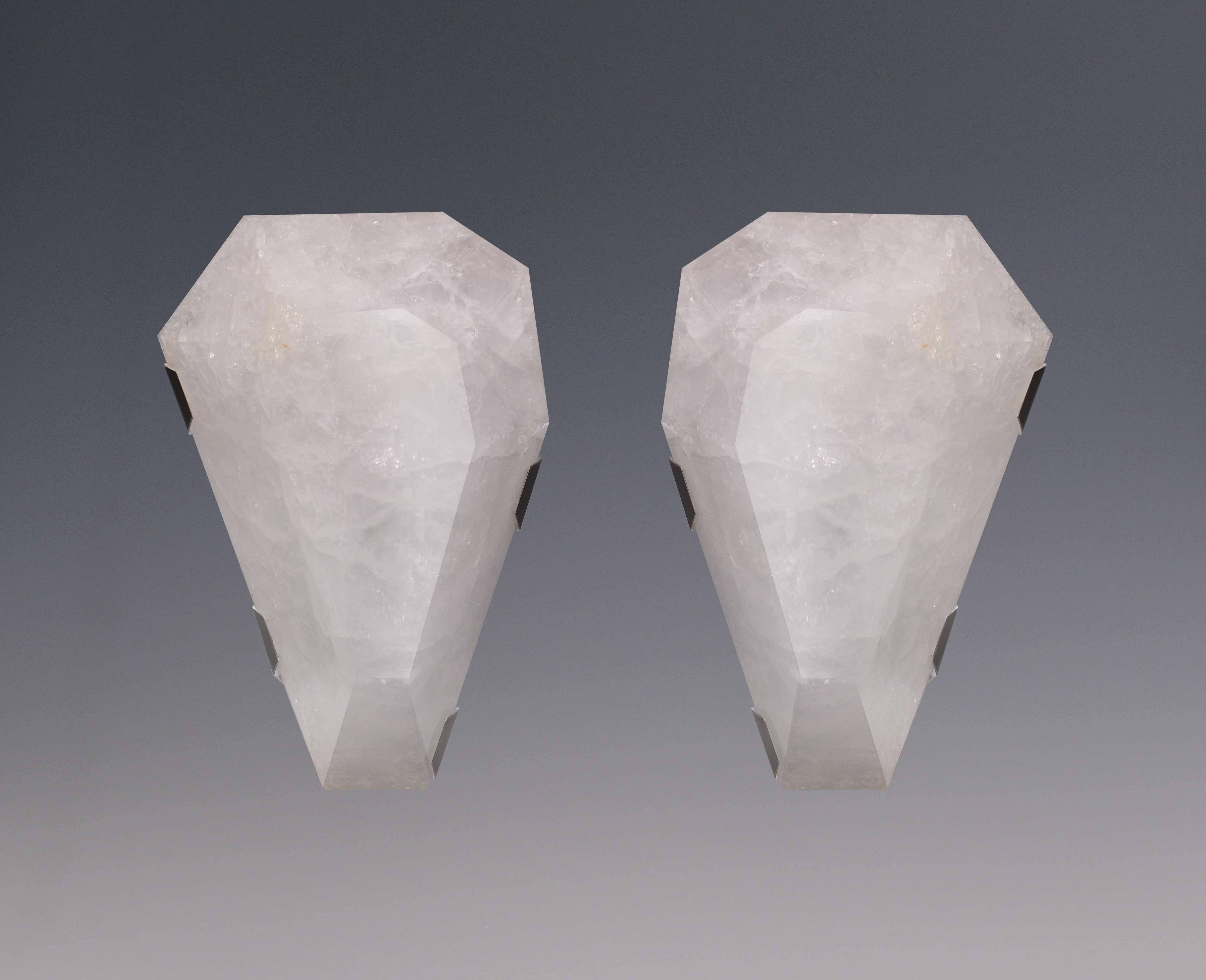 Pair of fine carved diamond form rock crystal sconces with antique brass mount, created by Phoenix Gallery, NYC.
Each sconce has two sockets with candle light bulbs max of 120W.
Custom measurement and finish available. 
15 in/H x 11 in/W List price: