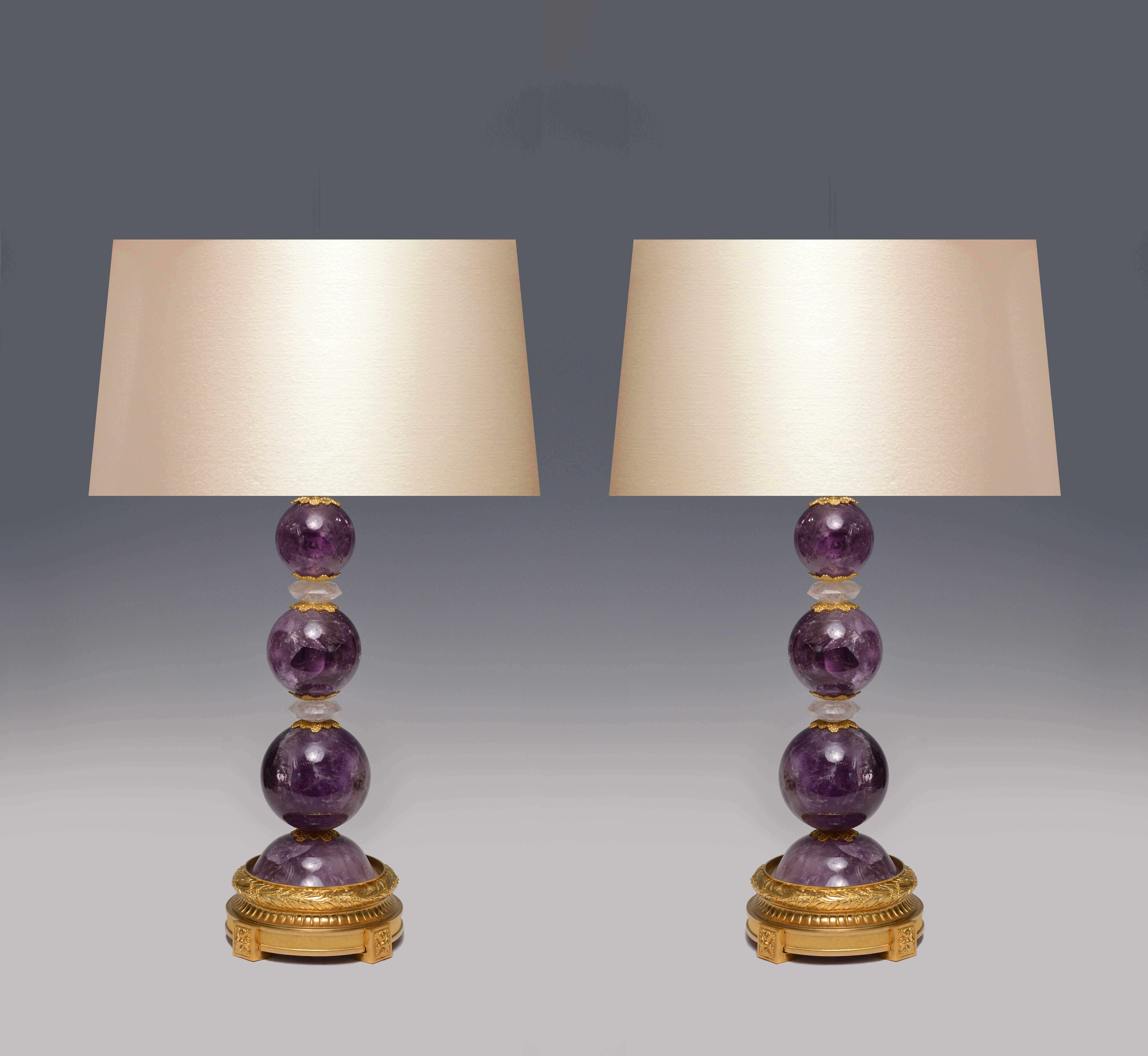 A global form amethyst rock quartz lamp with fine cast brass base, created by Phoenix Gallery, NYC.
To the rock crystal, measures 17