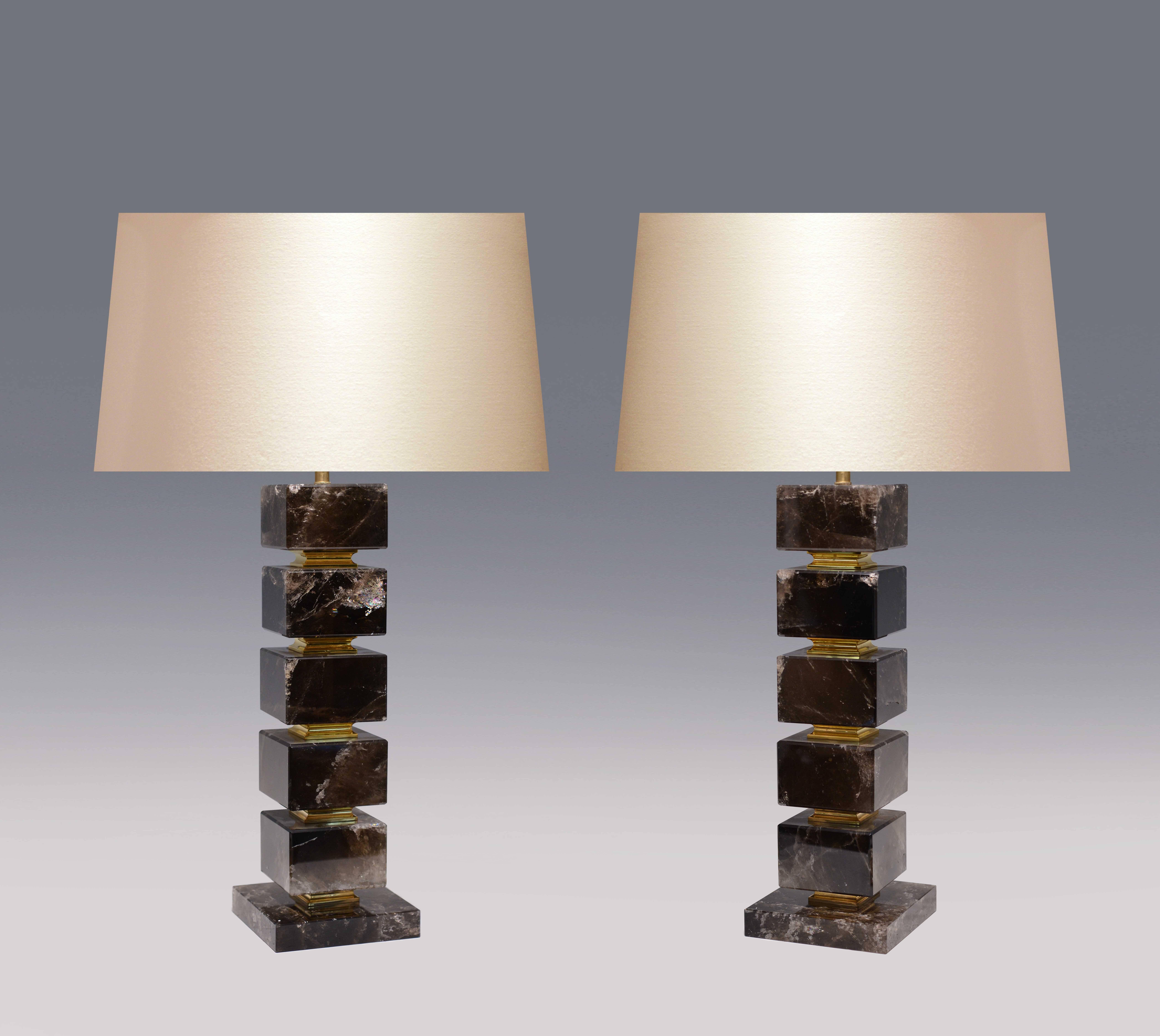 A cubic form smoky brown rock crystal quartz lamp with brass decoration, created by Phoenix Gallery, NYC.
Available in nickel plating and antique brass finished. 
Measures: To the rock crystal: 19