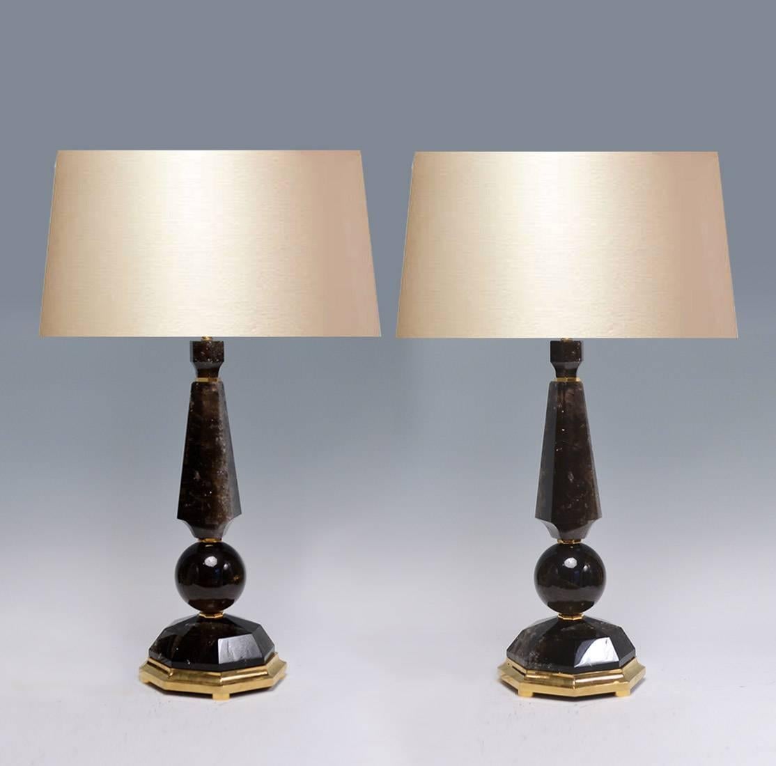 A fine carved prism and globe form dark rock crystal quartz lamp with polish brass base, created by Phoenix Gallery, NYC.
Available in nickel plating and antique brass finished.
Measures: To the rock crystal: 21.5