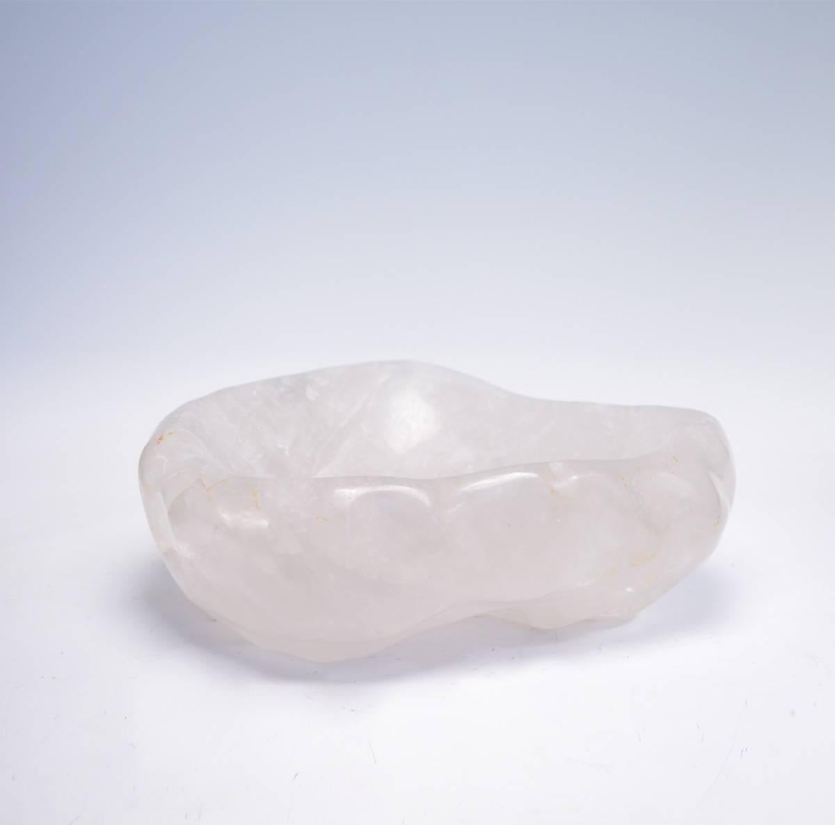 A large fine carved natural form rock crystal quartz centerpiece.
