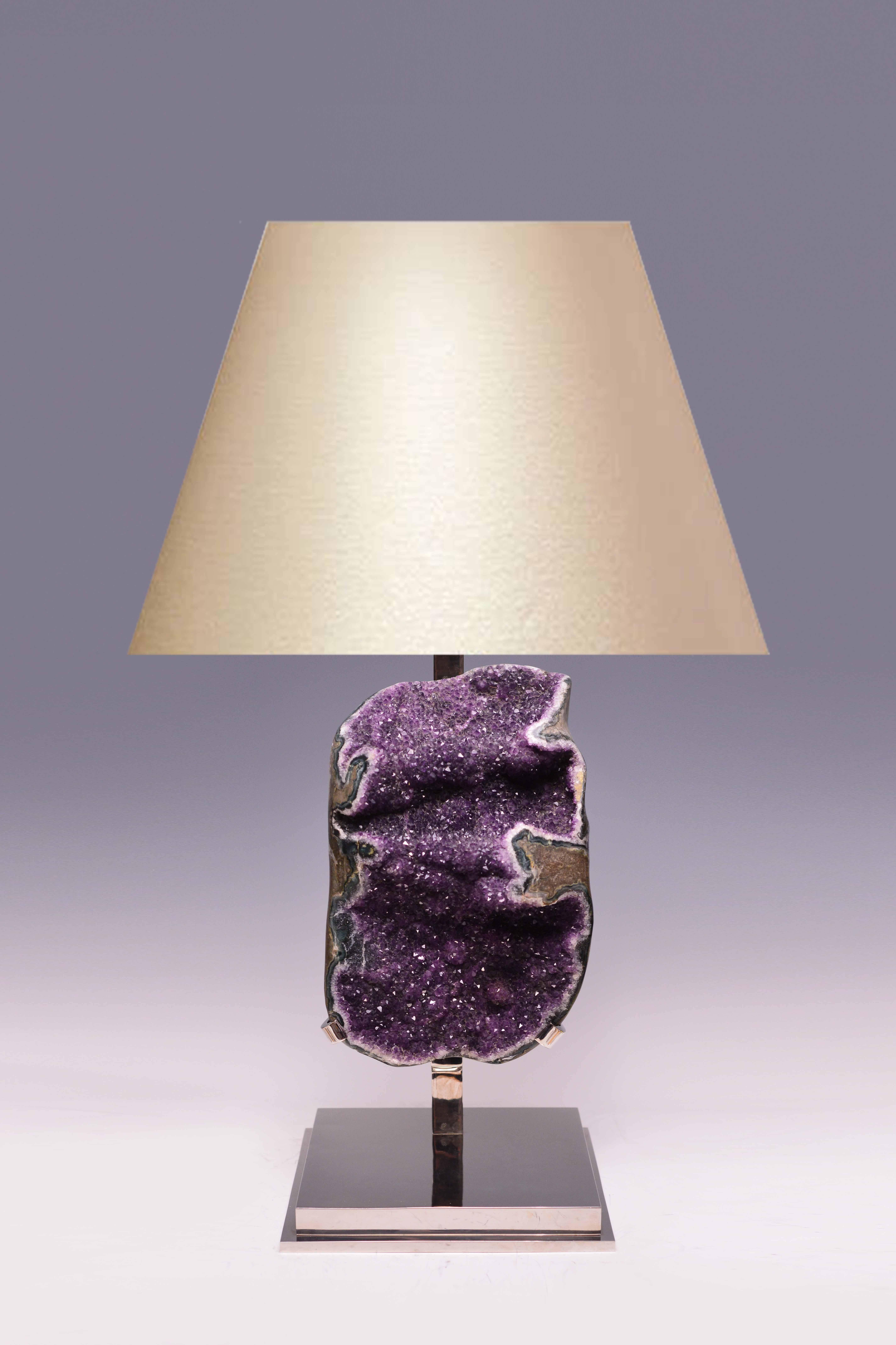 Natural amethyst rock crystal quartz, mounted as a lamp, created by Phoenix Gallery, NYC.
To the amethyst: 19.75