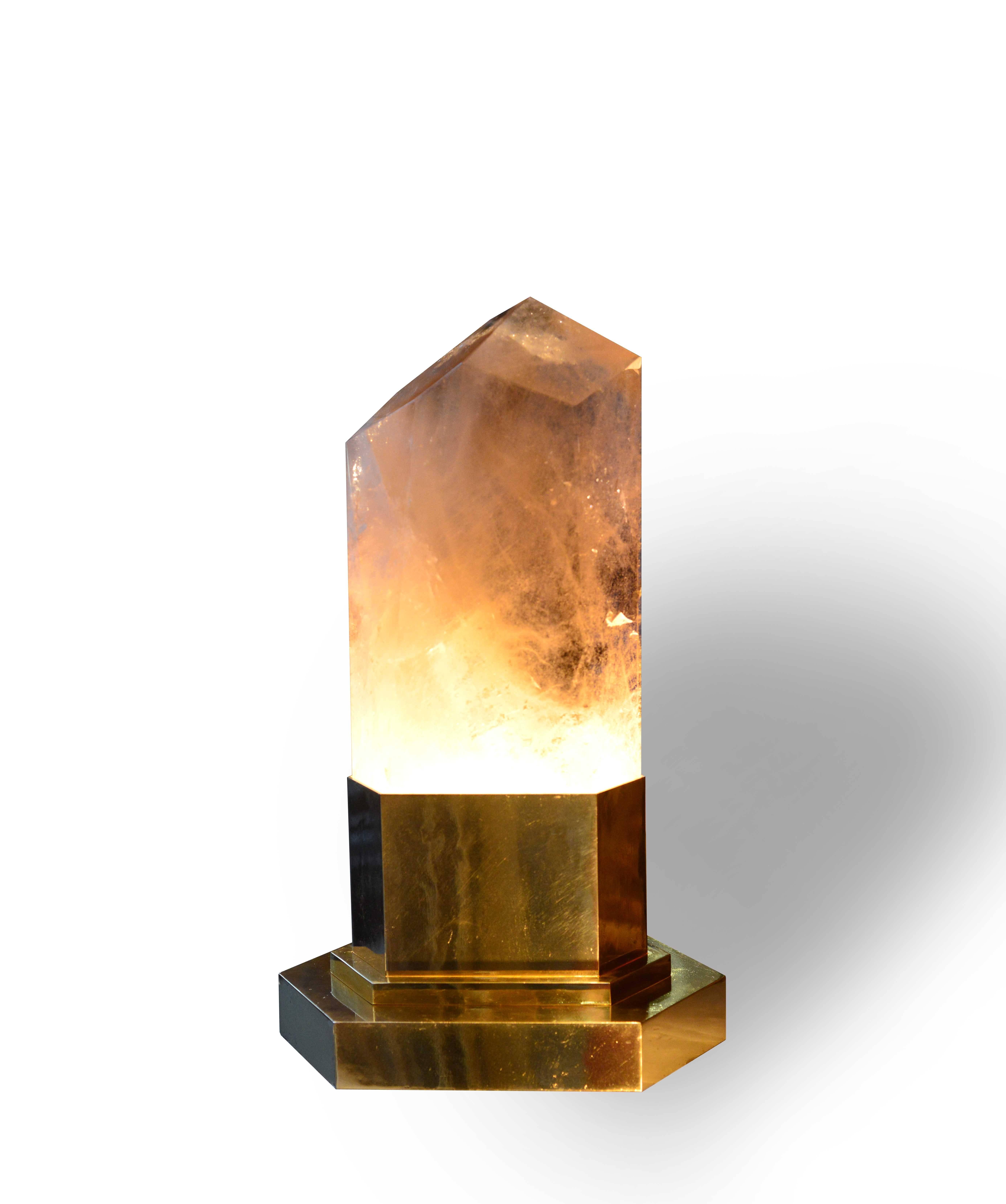 A carved smoky brown crystal obelisk light with tall gilt brass base, created by Phoenix Gallery, NYC.
Use regular Edison light bulb, the max is 60 watt.

For more rock crystal lightings, please search 
