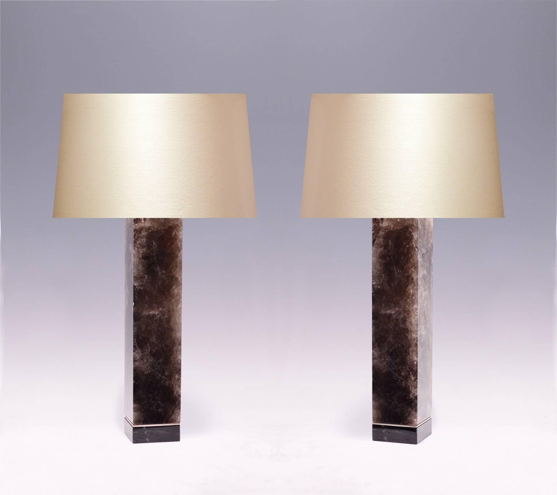 A pair of modern fine carved rectangular form smoky brown rock crystal quartz lamps, created by Phoenix Gallery.
Measures to the rock crystal: 18.25