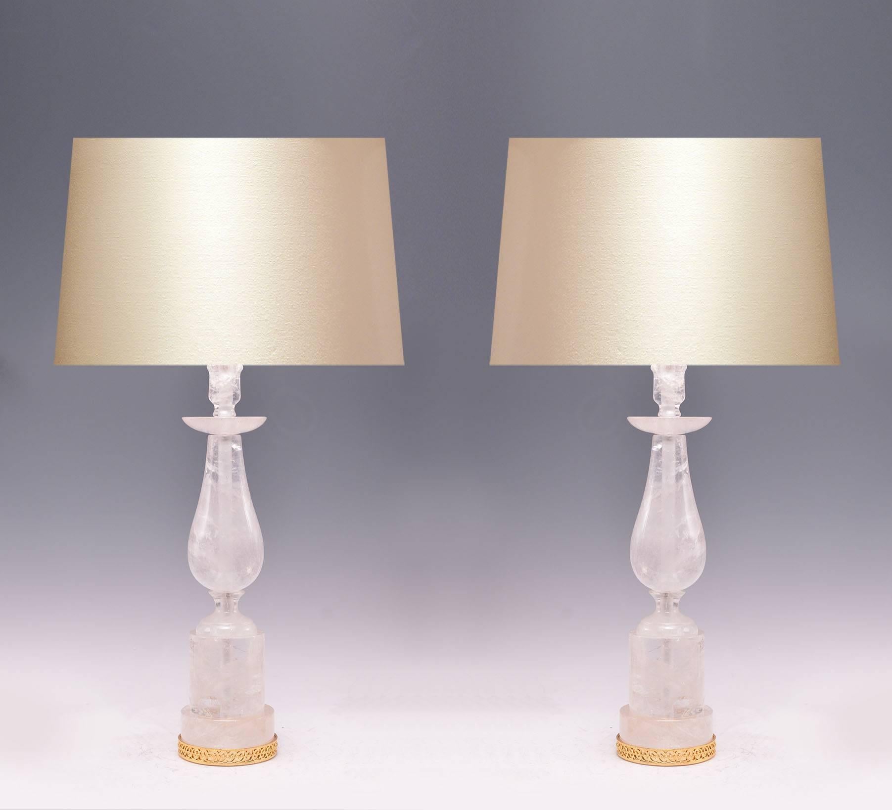 A pair of fine carved elegant form rock crystal quartz lamps with gilt base, created by Phoenix Gallery, NYC.
To the rock crystal: 22in/H.
(Lampshade not included).
