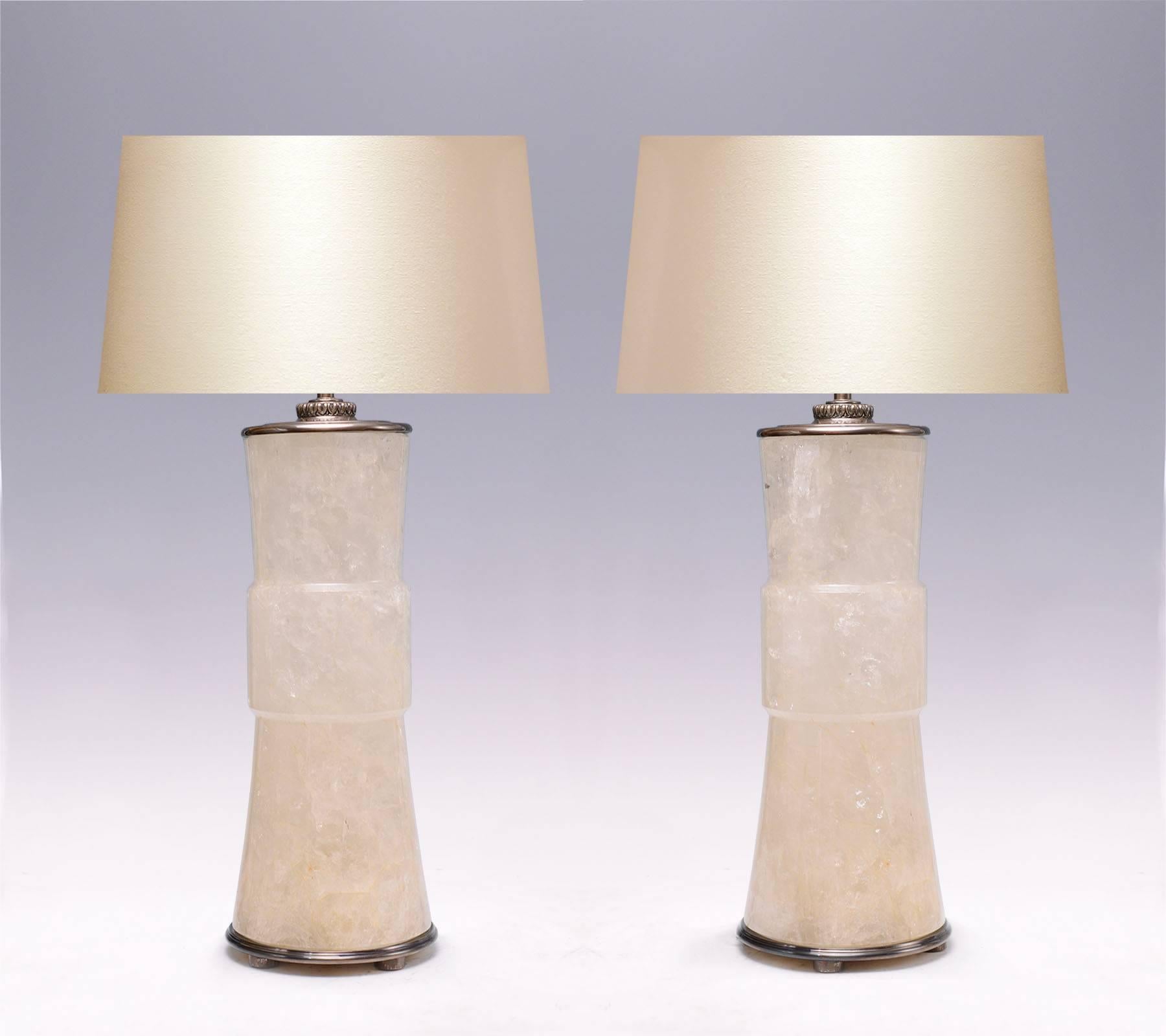 A pair of modern elegant form rock crystal quartz lamps with antique brass finish, created by Phoenix Gallery, NYC.
To the rock crystal: 18