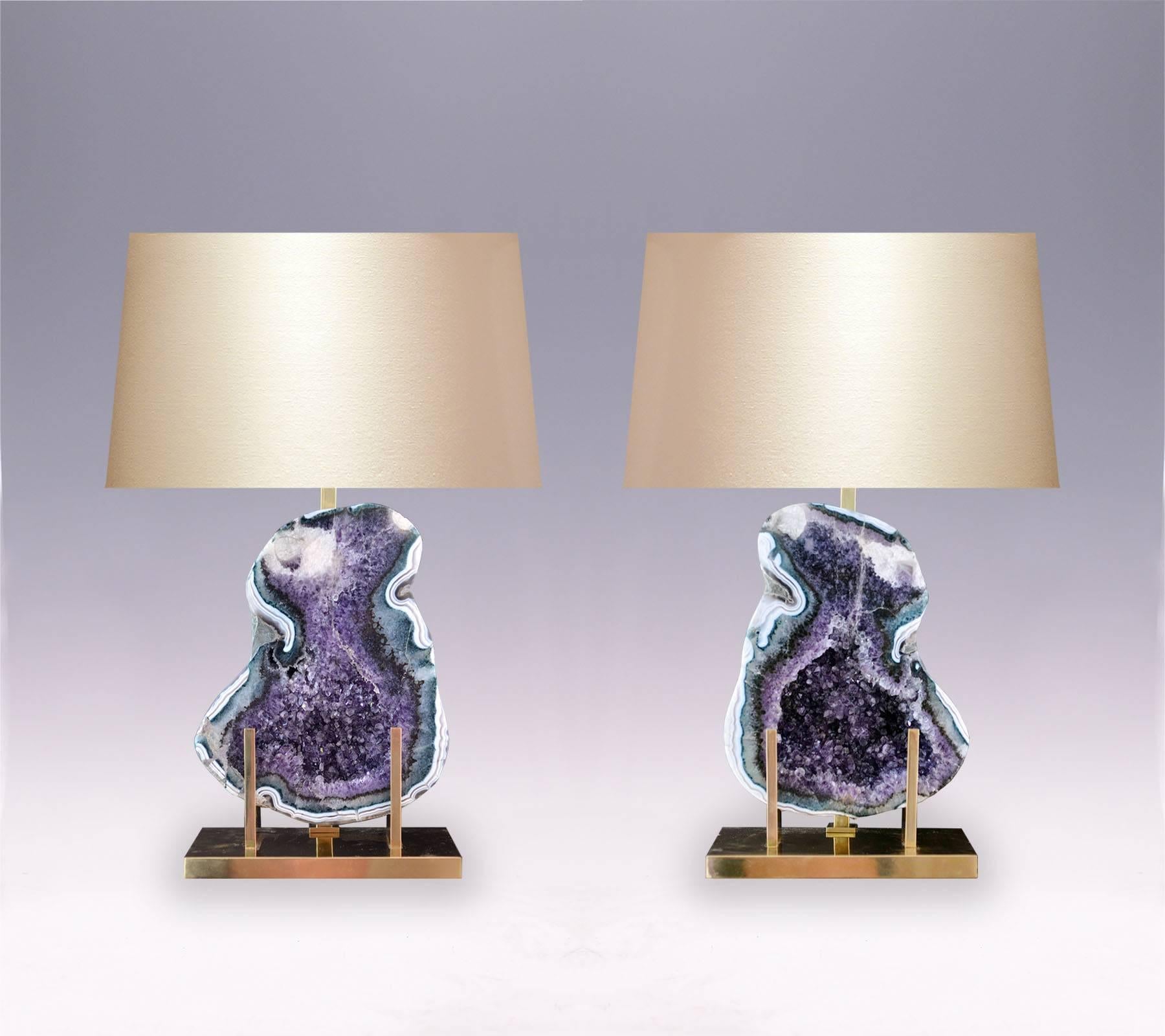 A pair of natural amethyst rock crystal lamps with amazing colorful amethyst stones, with polished brass mount, created by Phoenix Gallery, NYC.
(Lampshade not included).

For more Rock Crystal lightings and accessories from Phoenix gallery, please