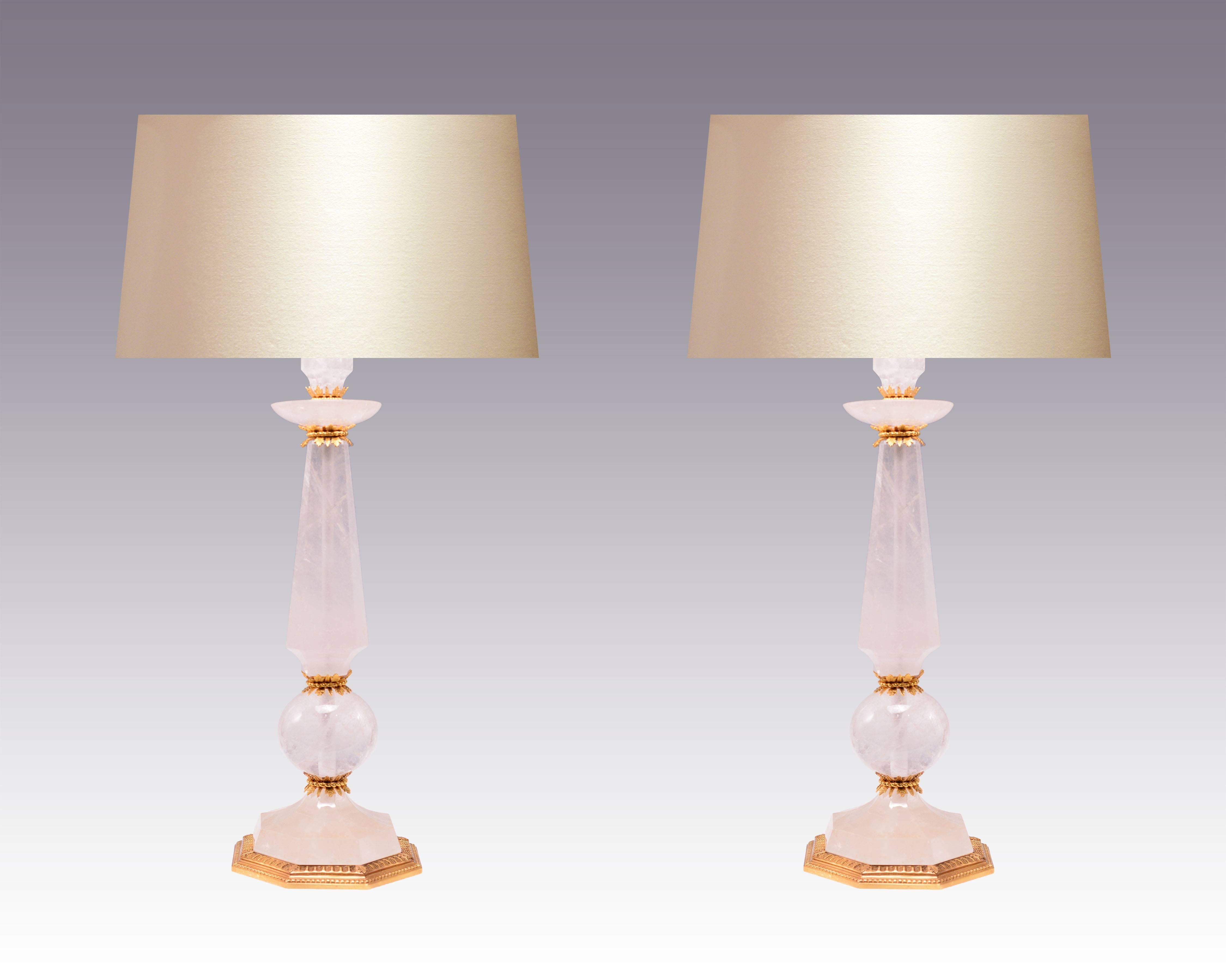 Pair of fine carved prism and globe rock crystal lamps with polish brass decorations and base, created by Phoenix Gallery, NYC.
Custom quantities available. 
To the rock crystal: 22in/H 
(Lampshade not included).
