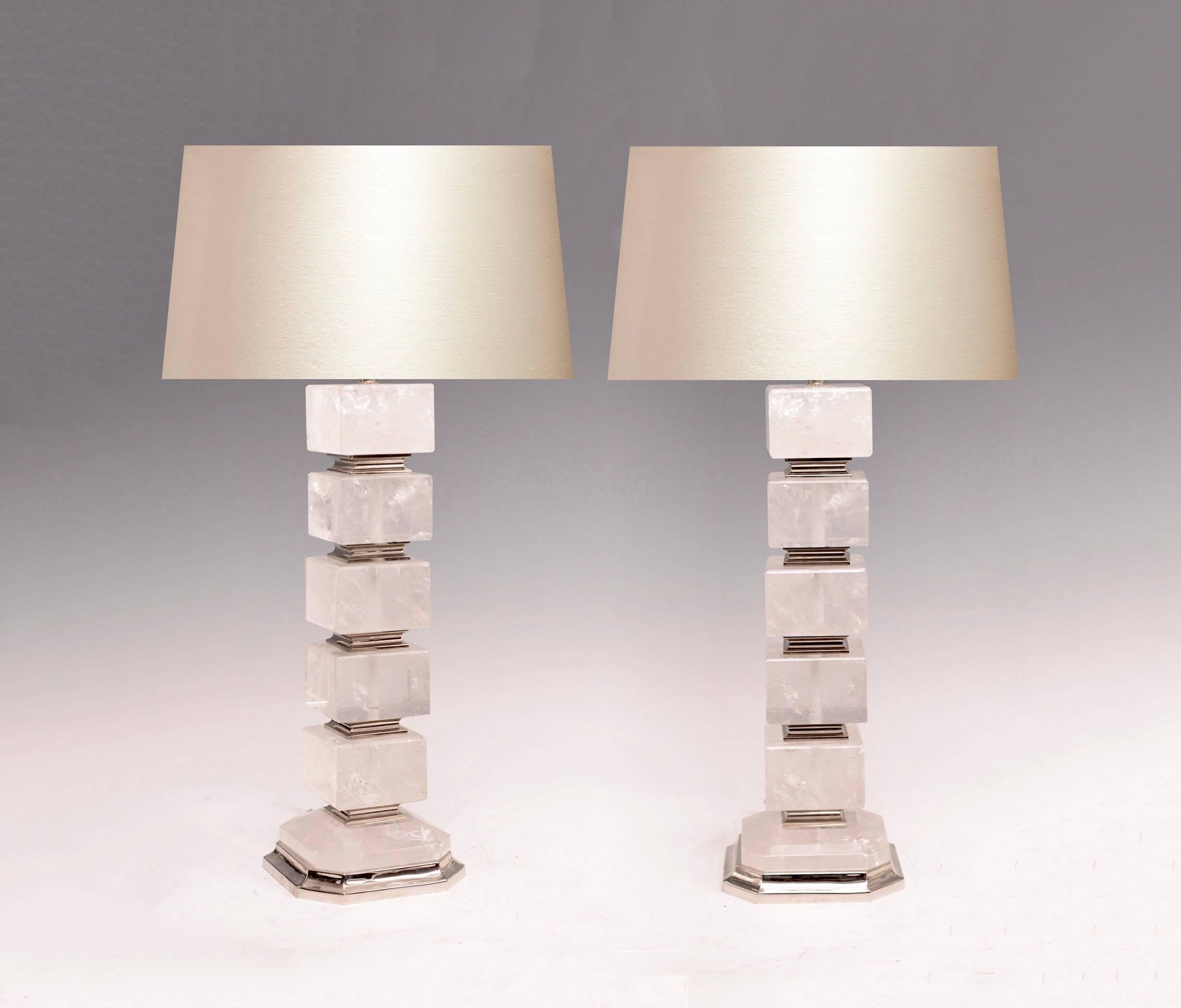 Pair of fine carved cubic form rock crystal lamps with nickel plating insertion and base, created by Phoenix Gallery, NYC.
To the rock crystal: 19 in/H
Overall Height: 30.5 in/H
lampshade not included.
