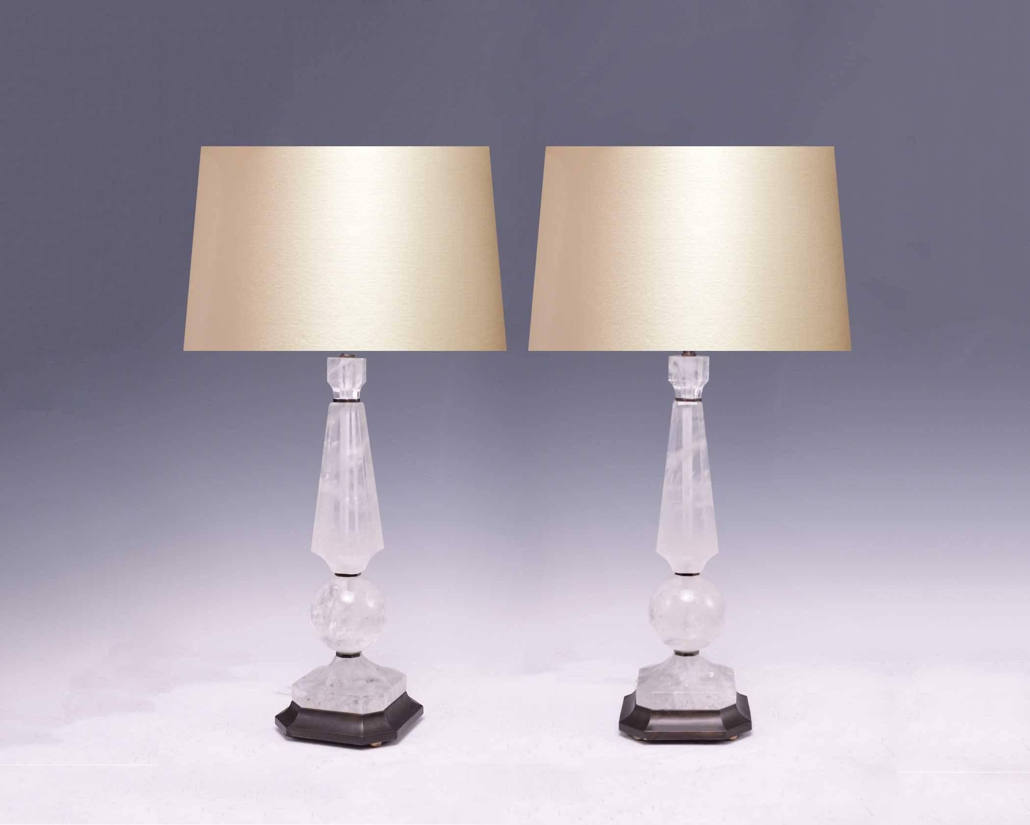 Elegant form rock crystal lamps with antique brass finish bases, created by Phoenix Gallery, NYC.
To the rock crystal: 20.5 in/H
Overall: 33.5 in/H
Lamp shade not included.
