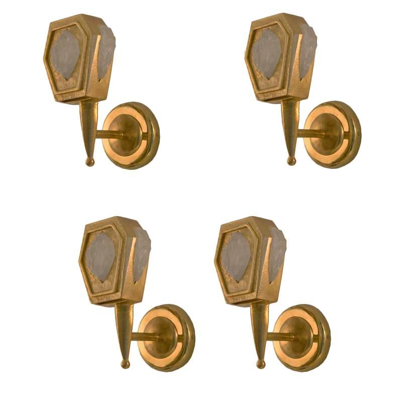 Group of Eight Repoussé hammered gilt bronze wall sconces with natural rock crystal decorations, created by Phoenix Gallery.
Each pair has a left and right. Each sconce is $1,800. 