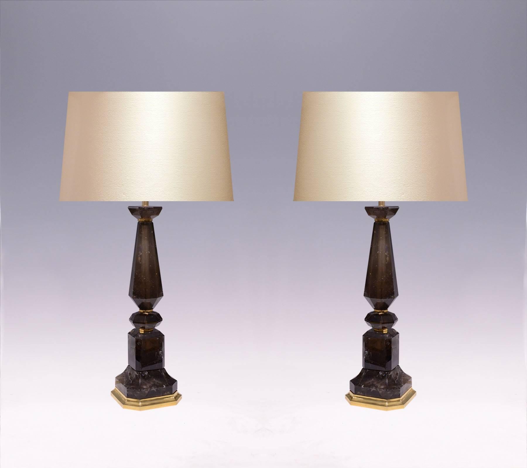 A pair of Fine carved smoky grey rock crystal quartz lamps with polished brass decorations.
To the rock crystal: 20