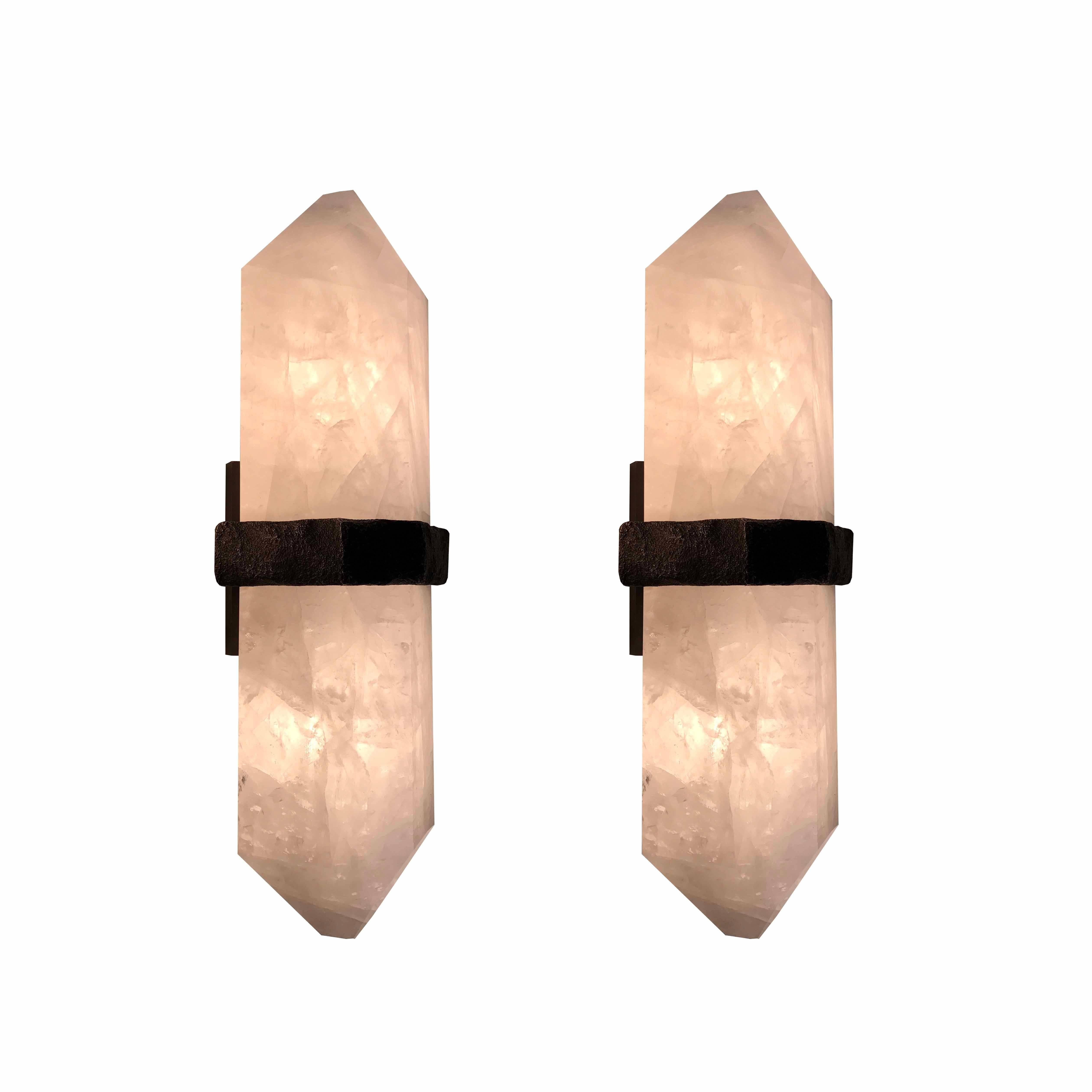 A fine carved diamond form rock crystal quartz wall sconces, mount with rich texture of cast brass decoration, created by Phoenix gallery NYC.custom size available 
Each sconces installed two sockets, and will including two LED light bulbs with 60