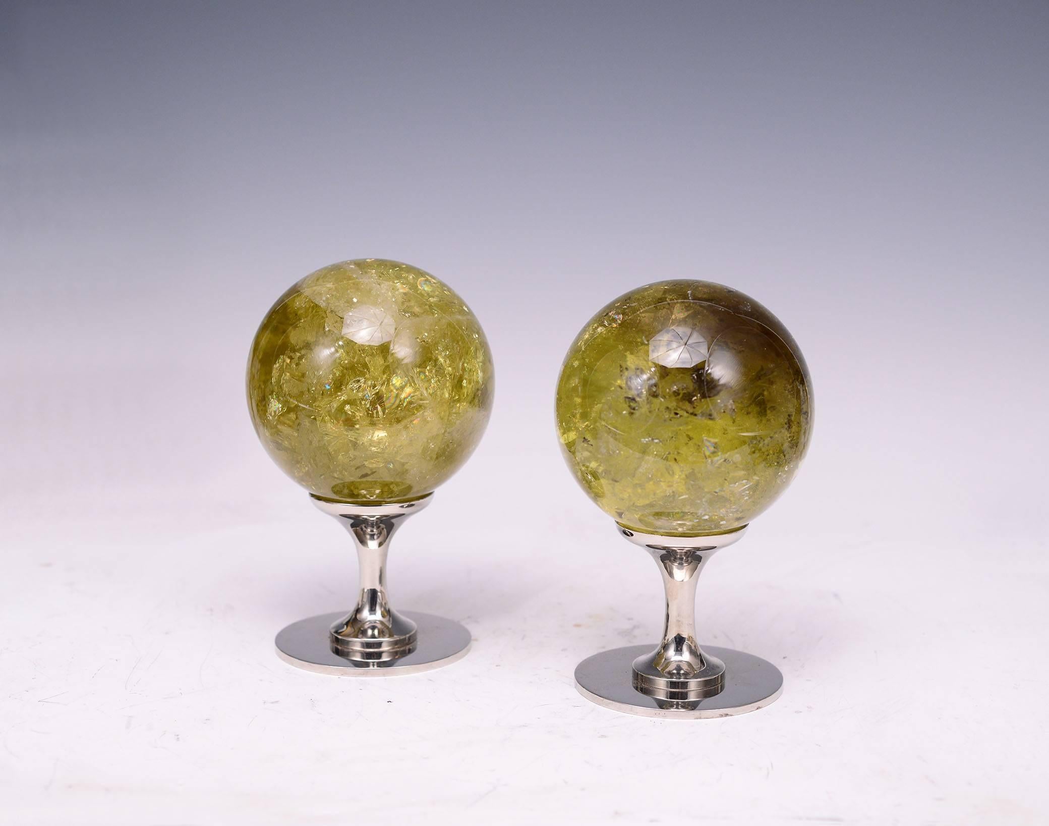 A group of two topaz rock crystal quartz balls with nickel plating bases, created by Phoenix Gallery, NYC.
Almost a pair.
Measure: (from left to right)
8.5