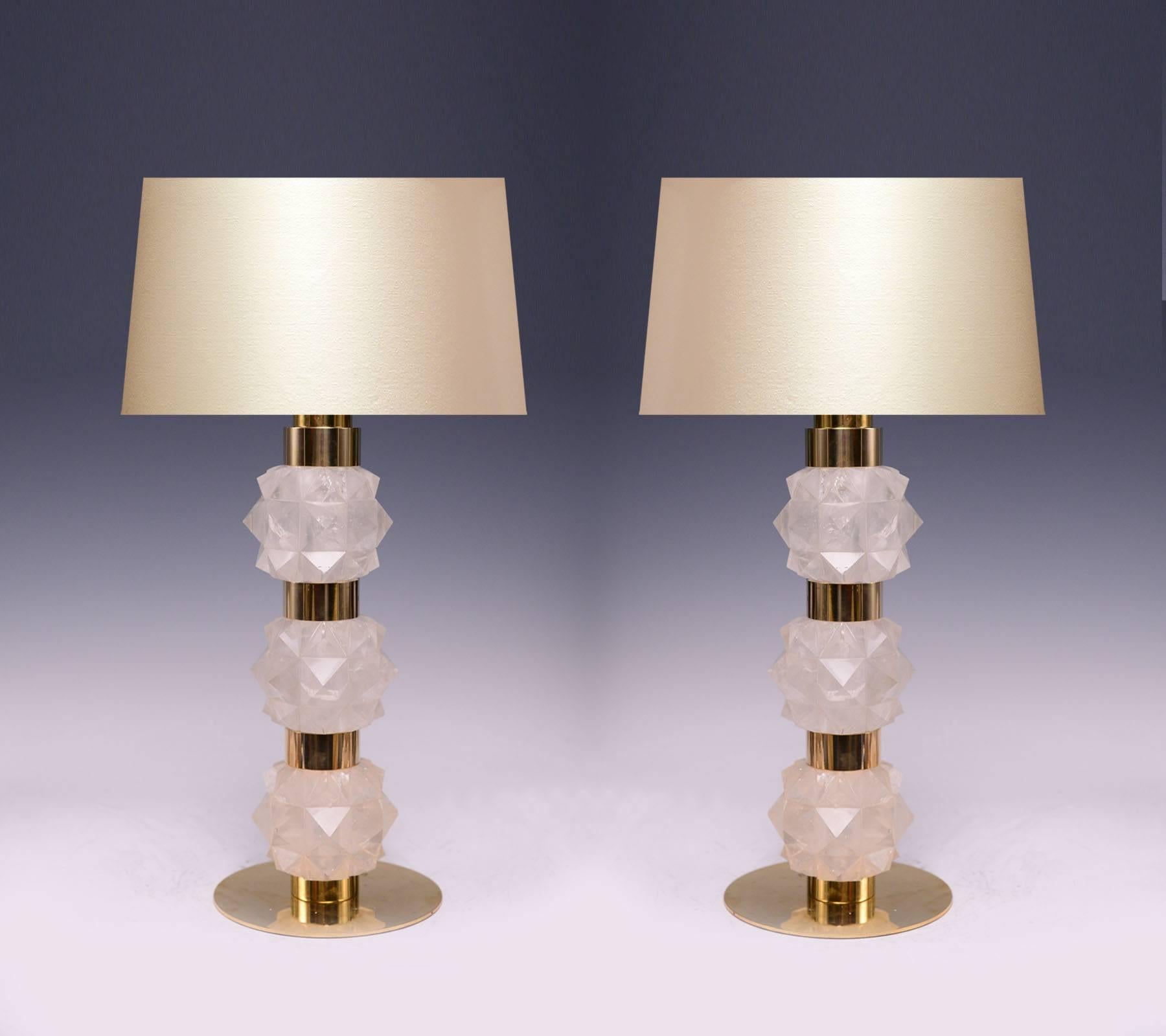 A pair of fine carved rock candy form rock crystal quartz lamps with polished brass decorations, created by Phoenix gallery.
Lampshade not included.
