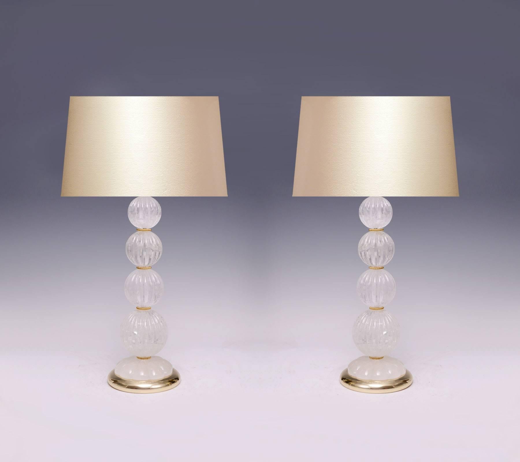 A pair of contemporary rock crystal quartz lamps with a group of fine carved notch balls and polish brass base, created by Phoenix gallery, New York City.
Measure: To the top of the rock crystal: 17