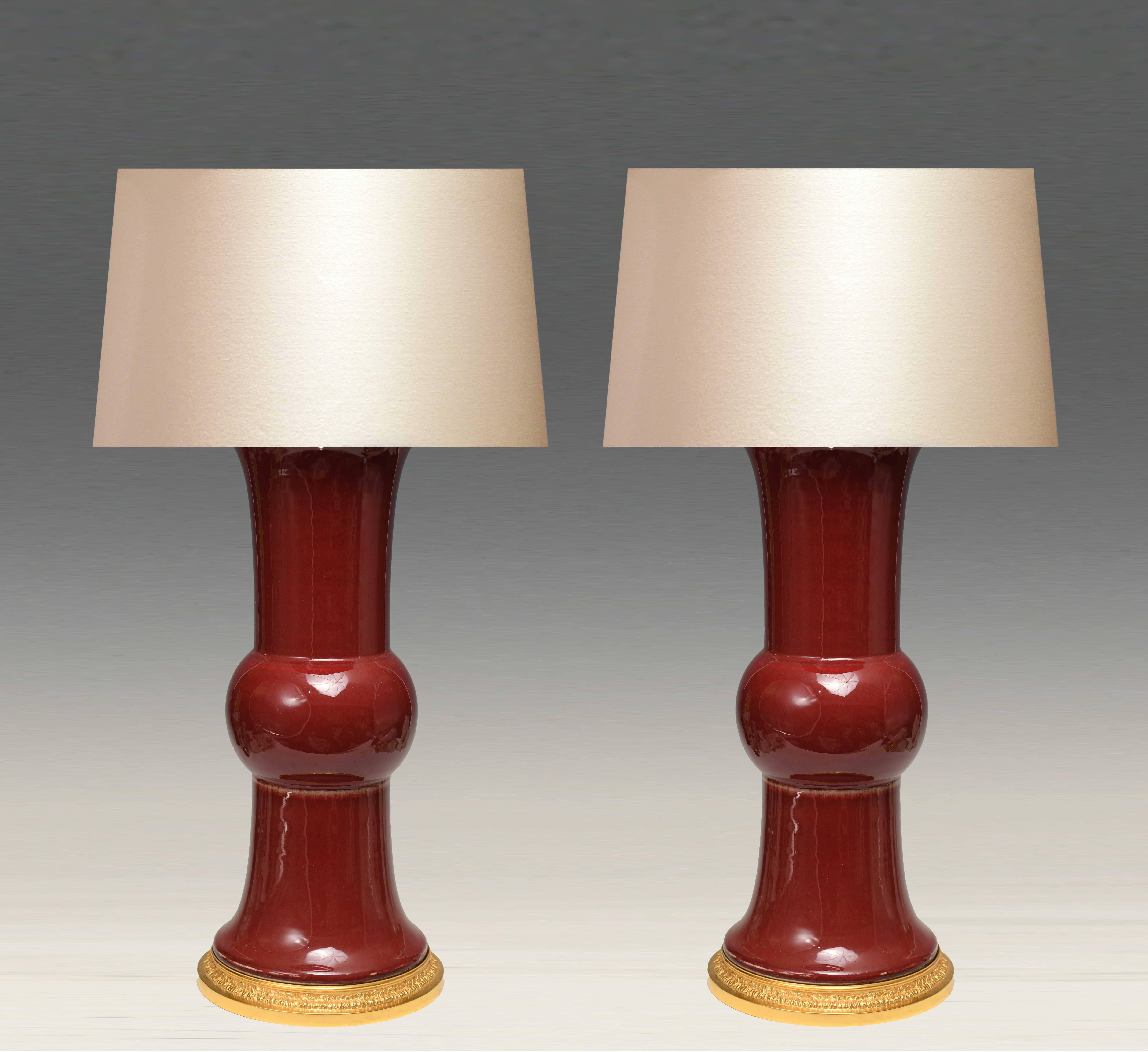 A pair of oxblood porcelain lamp with fine cast gilt brass bases.
Measure: To the top of the porcelain: 19