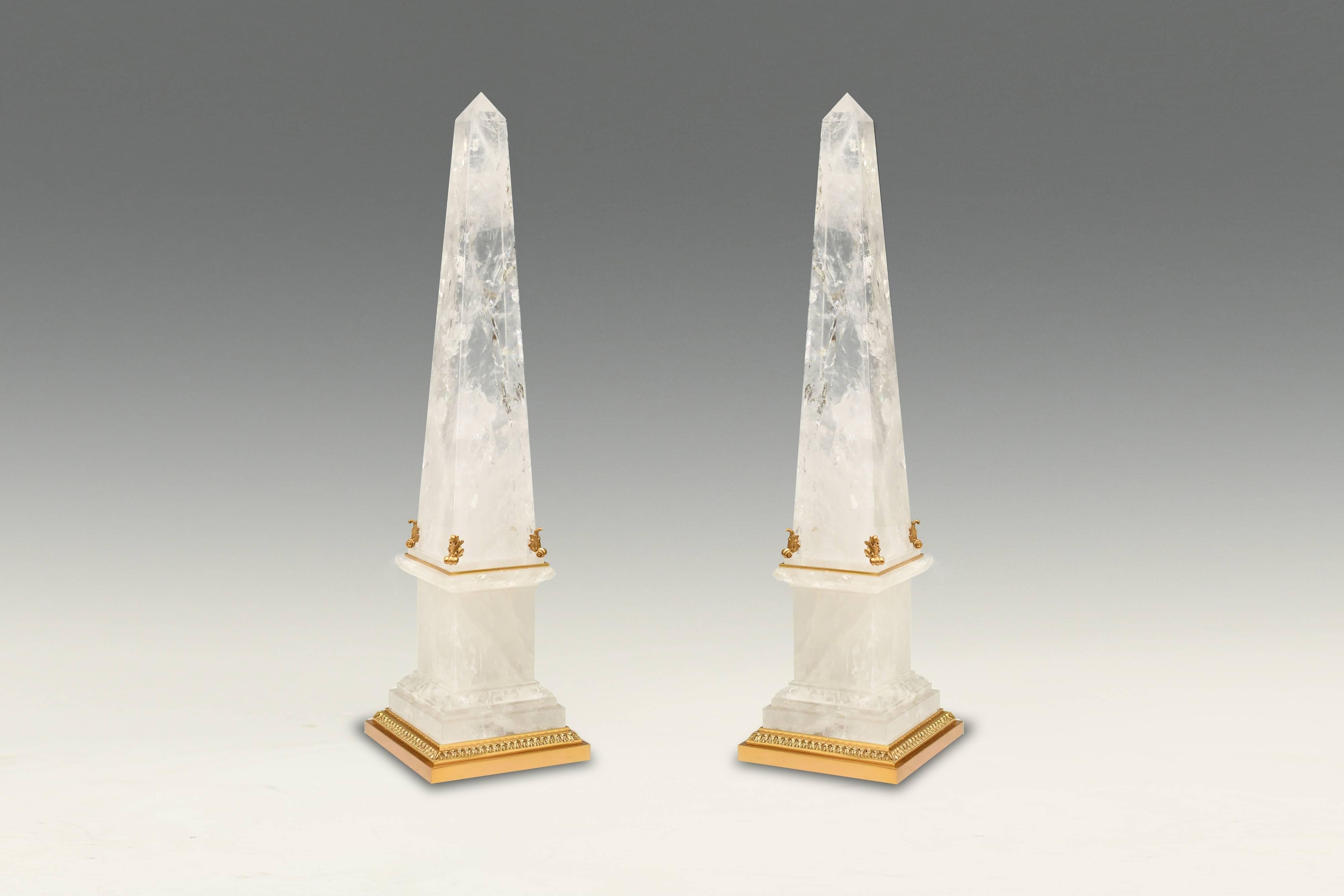 A pair of rock crystal obelisks with fine carved metal decoration, created by Phoenix Gallery, NYC.
