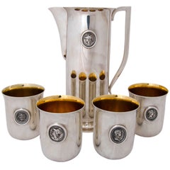 Water Pitcher and Four Matching Beakers