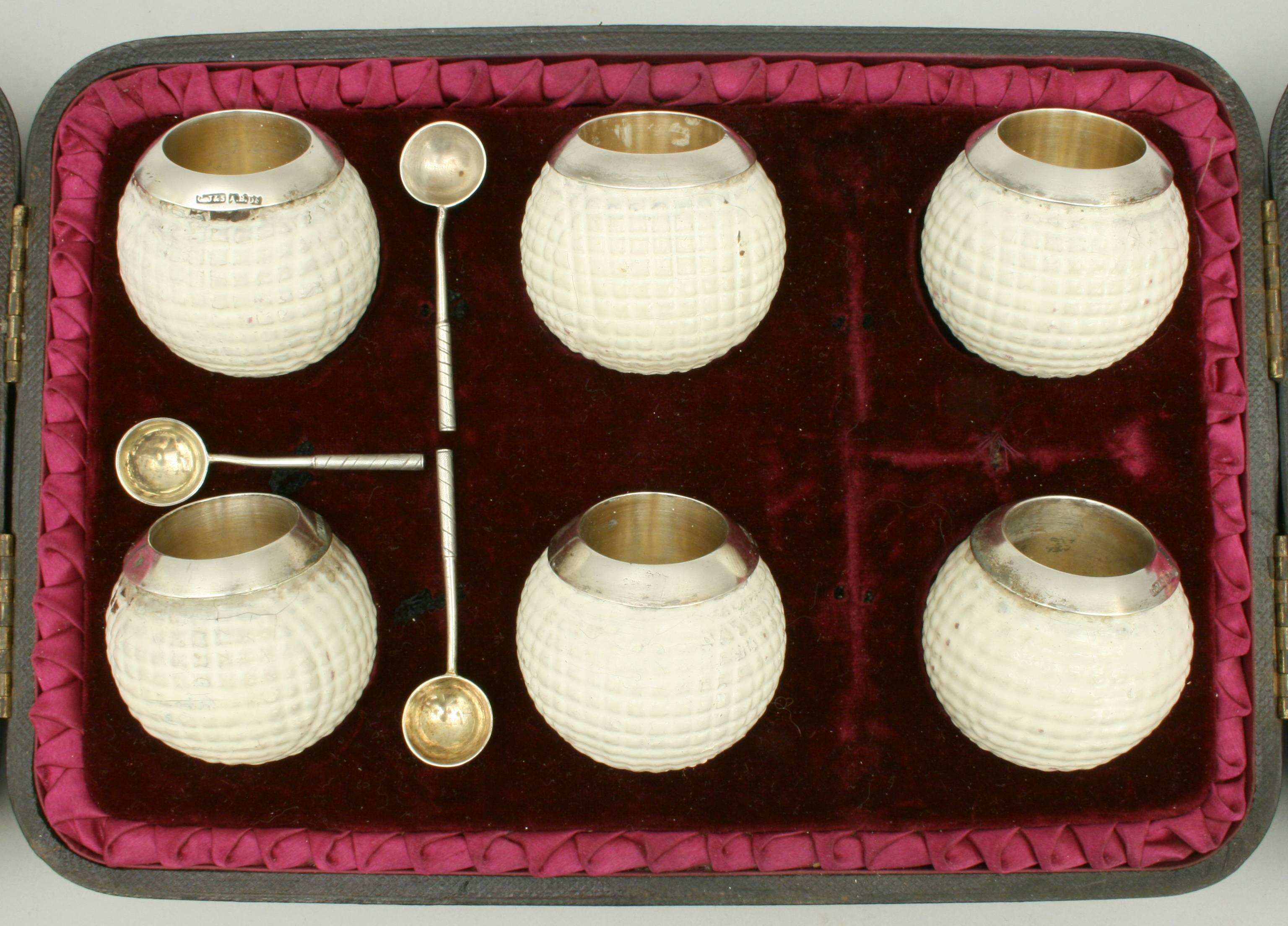 Vintage golf ball salts in presentation box.
A very rare set of six golf ball salts in original case by George Jamieson & Son, Aberdeen. The black presentation case with purple silk lining and crushed velvet fitted base. The hinged lid opens in