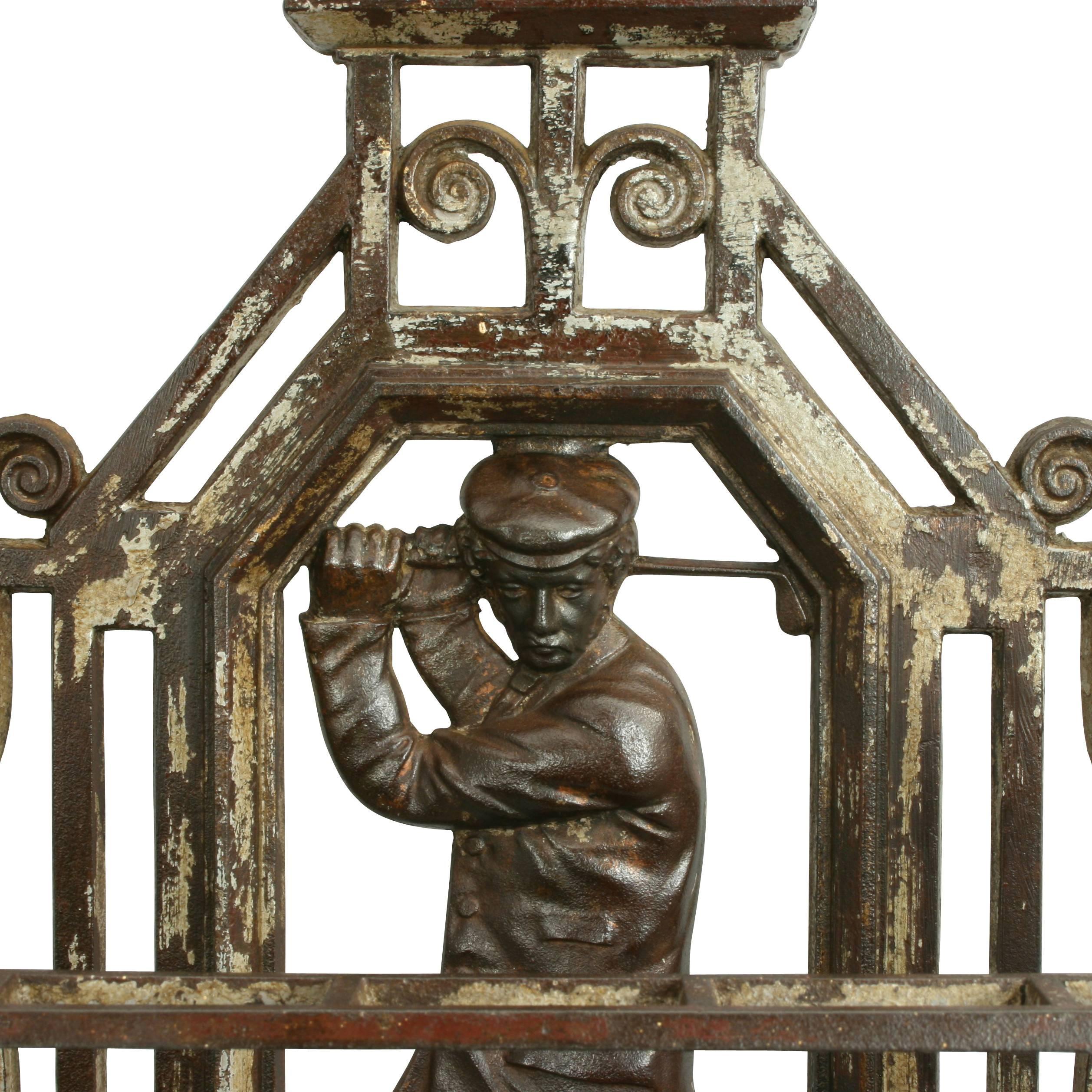 A most wonderful Victorian, cast iron golf umbrella stand.
An original unusual antique cast iron umbrella or stick stand. The back plate depicts a golfer in full back swing, inscribed above 'Golfer'. The stand comes with the two original removable