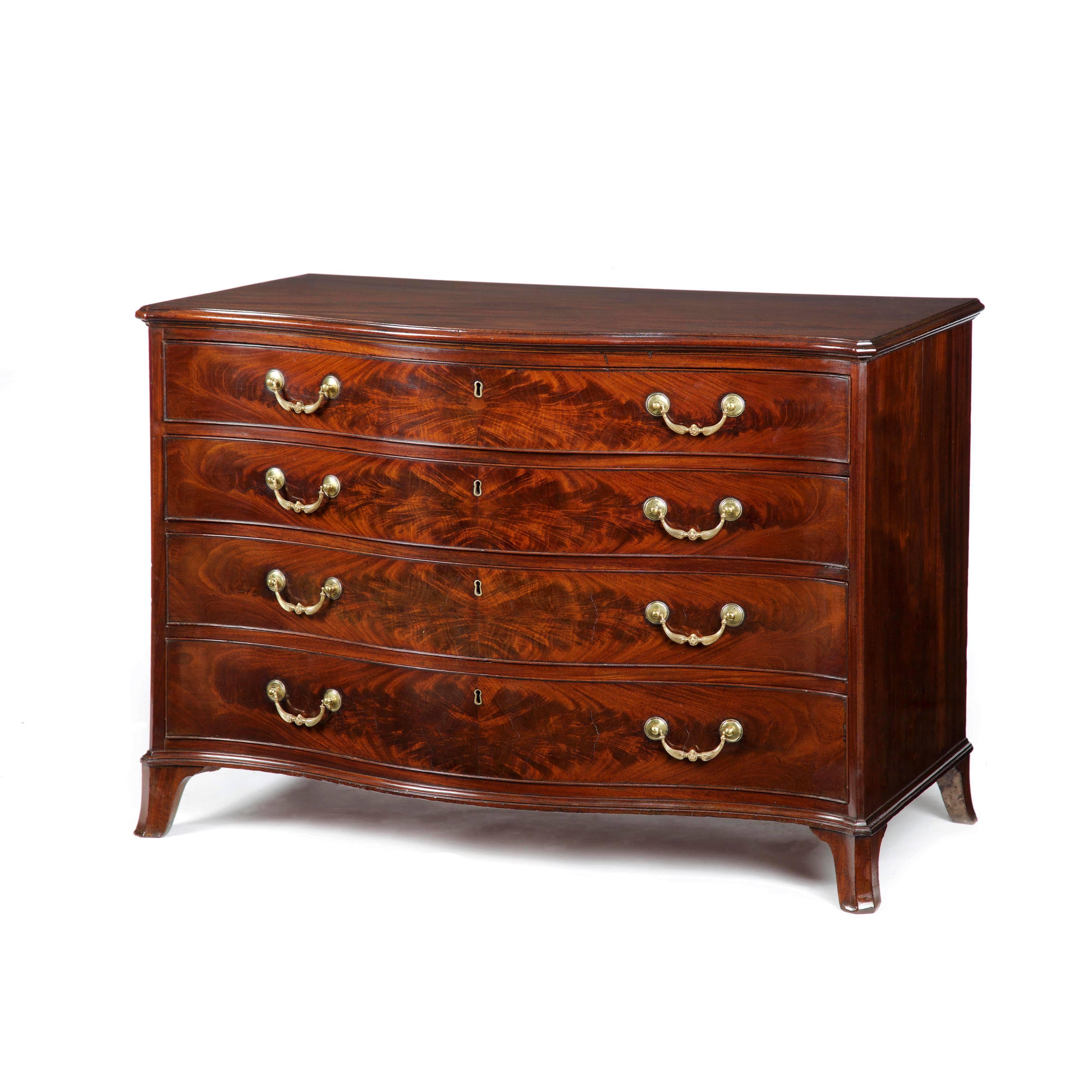 A fine George III figured mahogany serpentine commode of wonderful proportions and of excellent original color and patina, attributed to Gillows of Lancaster. The serpentine top with canted front corners and a moulded edge to three sides. Below four