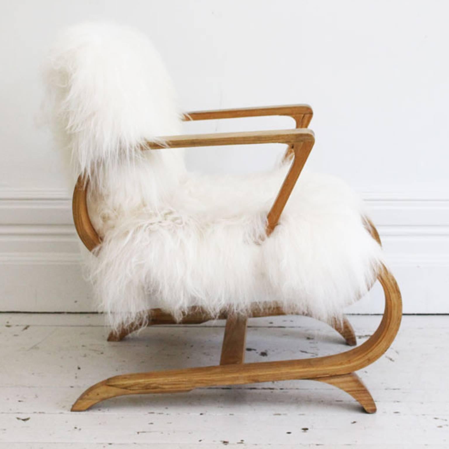 Pair of 1950s Cantilever French Armchairs Covered in Icelandic Sheepskin In Excellent Condition In Kent, GB