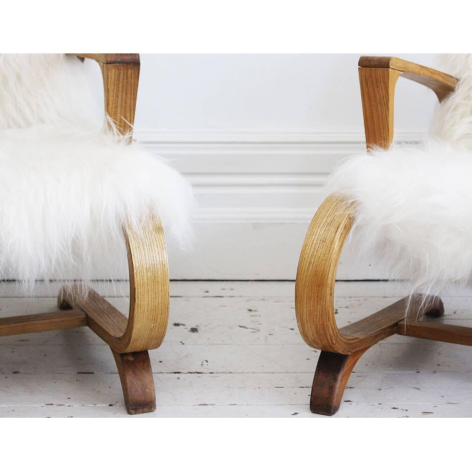 Mid-20th Century Pair of 1950s Cantilever French Armchairs Covered in Icelandic Sheepskin