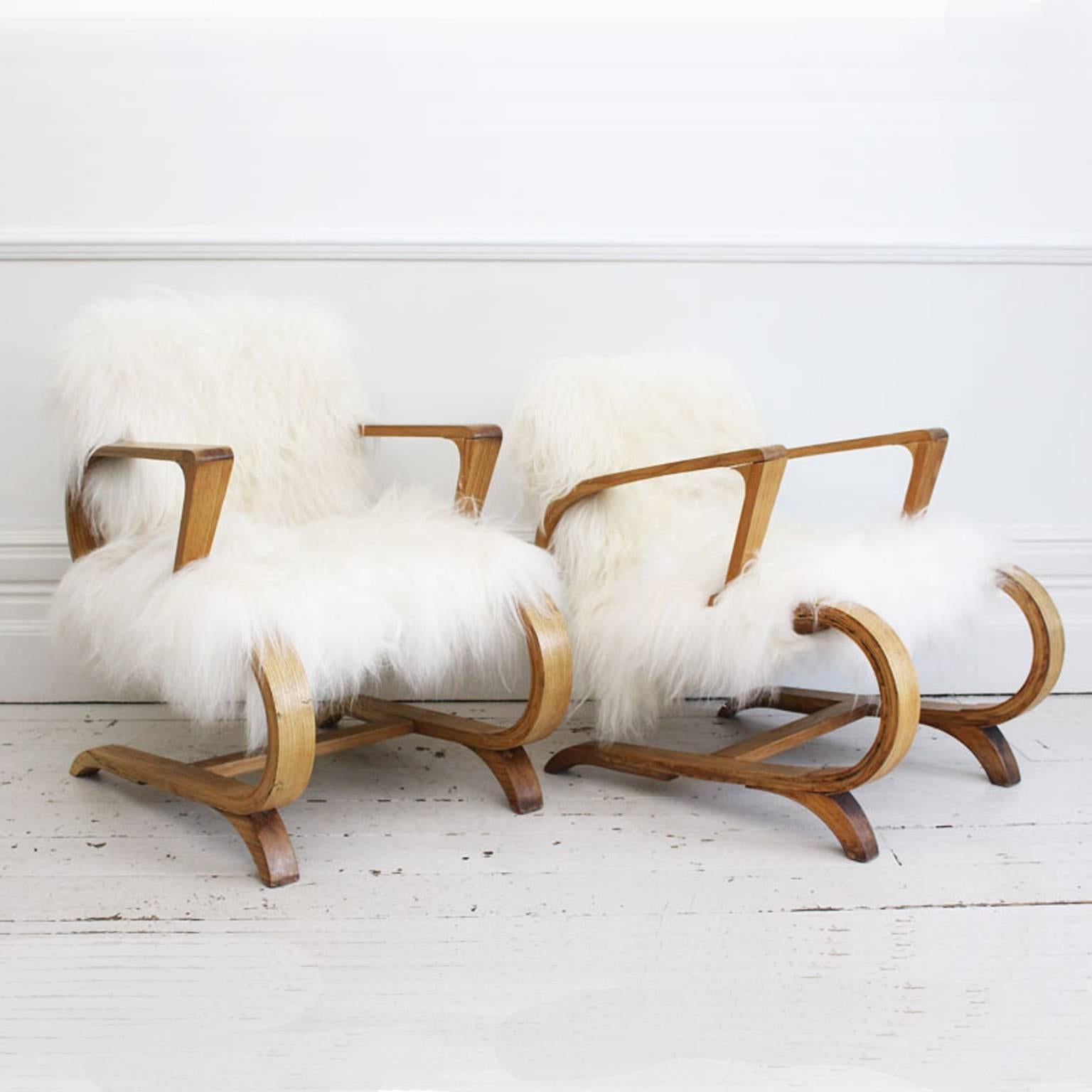 Mid-Century Modern Pair of 1950s Cantilever French Armchairs Covered in Icelandic Sheepskin