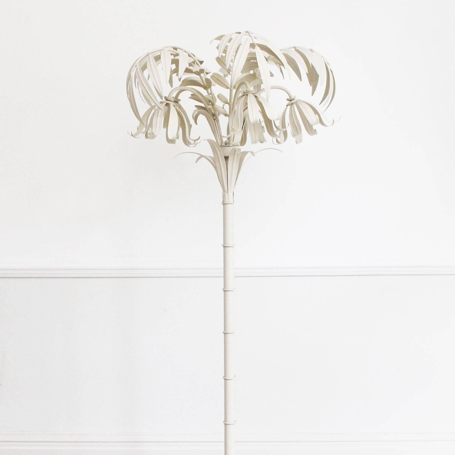 It is not really possible to show just how fabulous this light is in a photograph but we have tried. This highly decorative piece is shaped like a palm tree and made from painted metal. Hidden within the palm leaves are five lights. As you will see
