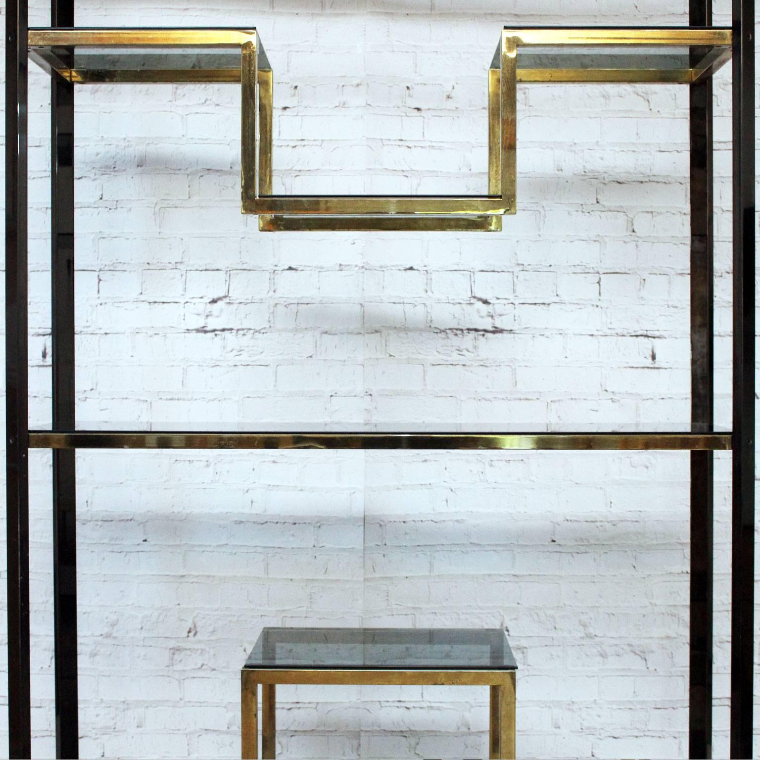What a beautiful piece of design this etagere is. It was designed in the 1970s by renowned designer Guy Lefevre for the French design house Maison Jansen. The H shaped central design is especially lovely. This is a weighty piece, the brass plated