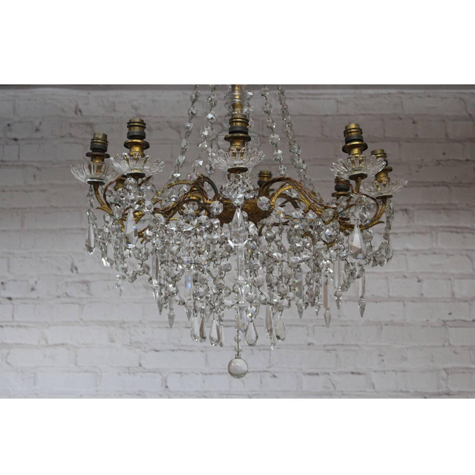 Beautiful and decorative, understated yet ornate, this wonderful chandelier would look fabulous in pretty much any setting. Why not mix it with contemporary furniture? This light even has it's original glass central decoration. Decorated with