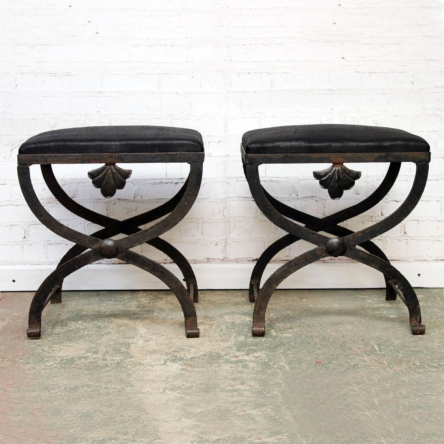 Here we have a rather wonderful pair of black iron stools with lovely shell detail. The black metal has a wonderful patina. We have had them reupholstered in black horsehair-type fabric. We love the lines of the X frame legs.

Basic to the door