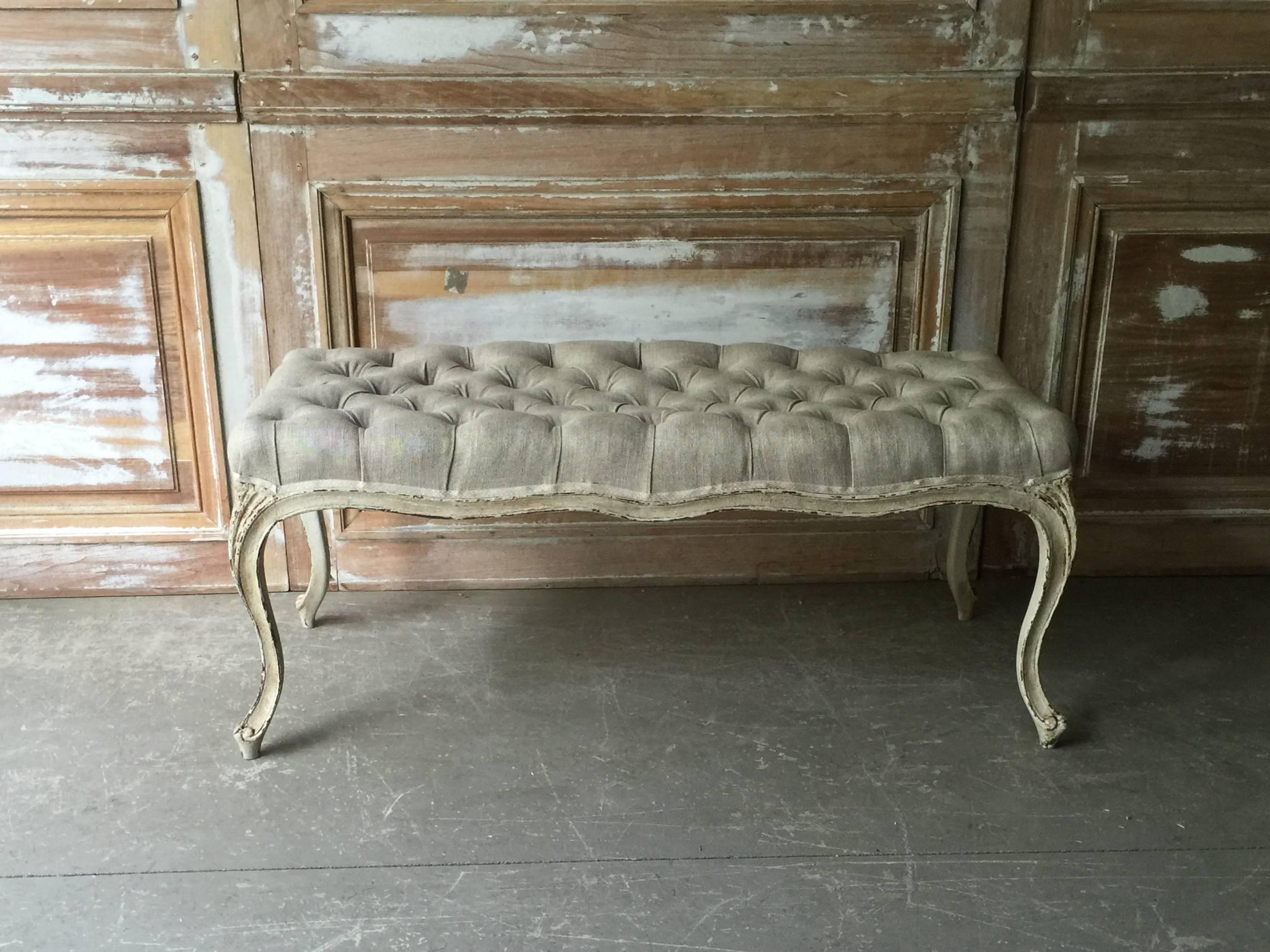 French LXV style small bench with shaped scalloped frieze, raised on slender cabriole legs. Upholstered in linen with classic elegant tufted style and gimp trim.
France, circa 1900.

Surprising pieces and objects, decorative and rare items.