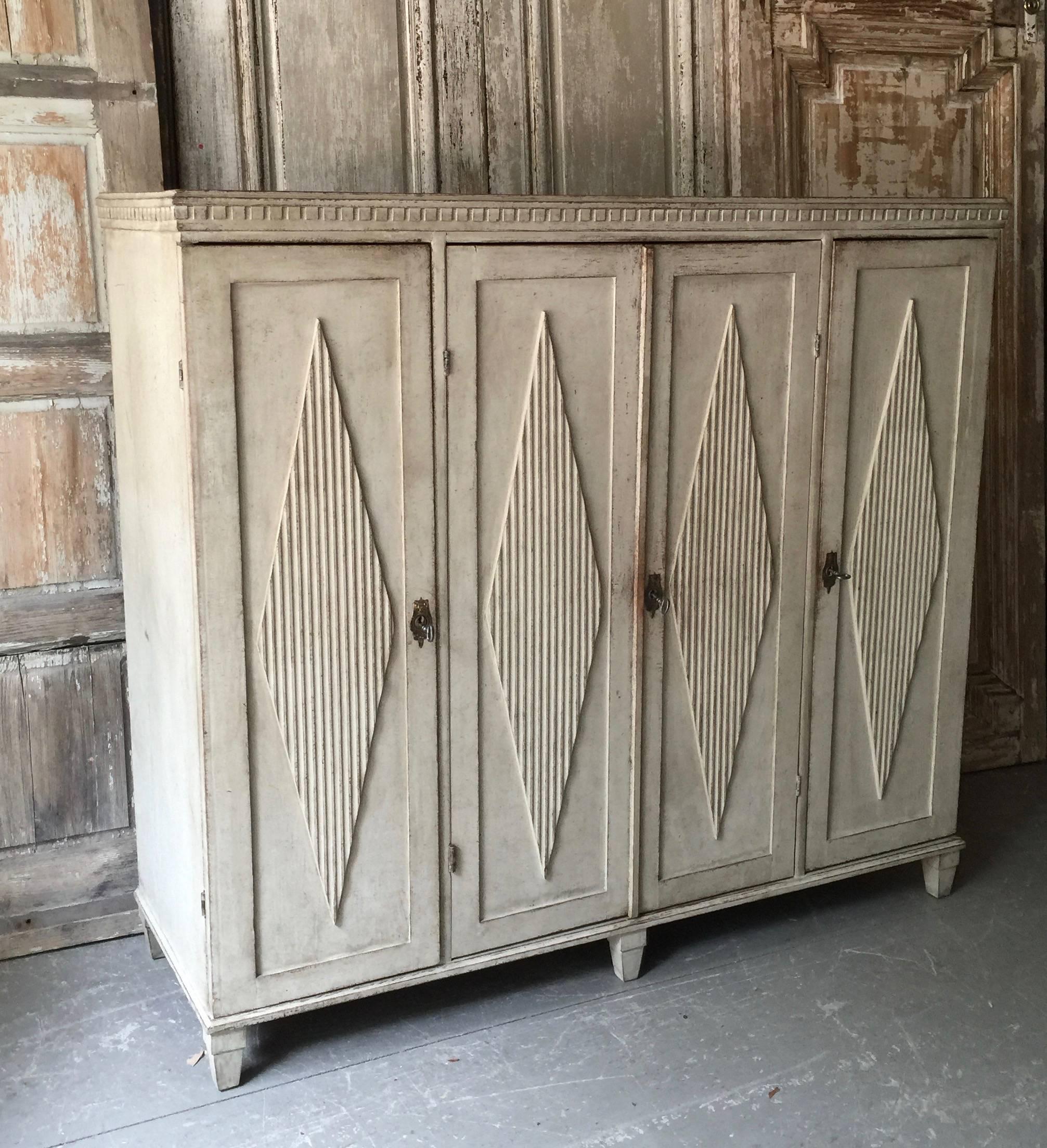 Large 19th century Swedish Gustavian sideboard in classic Gustavian style including four-panelled doors with diamond shaped lozenges. Inside five drawers for extra storages. Wonderful find,
circa 1860, Sweden.
Here are few examples surprising