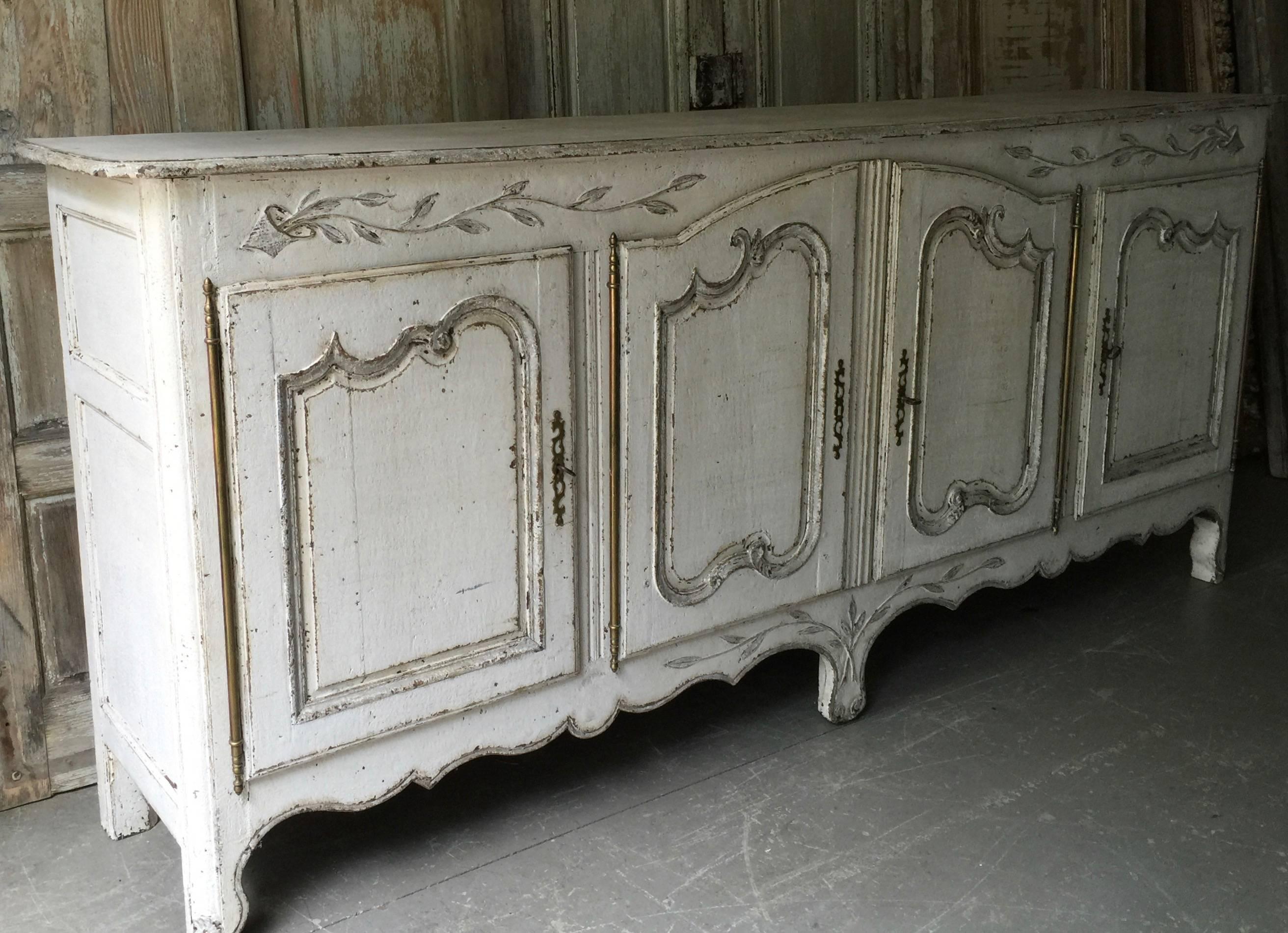 Handsome 19th century pained Enfilade in Louis XV style with four raised panel doors in richly carved lovely floral designs, France, circa 1850.

Here are few examples surprising pieces and objects, authentic, decorative and rare items that you