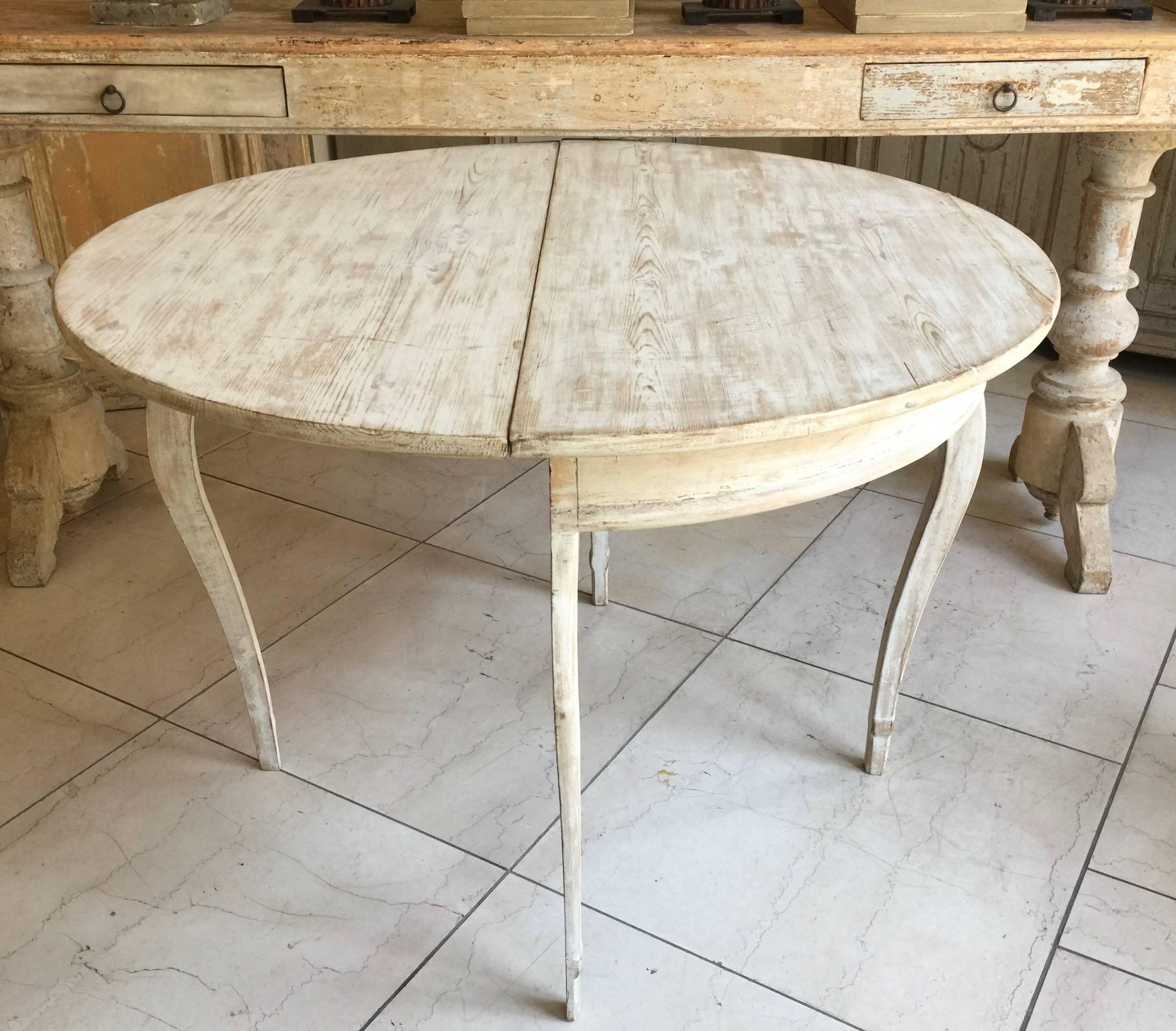 Swedish Demilune folding table with delicate cabriole legs in Rococo style and layers of paints scraped to original color,
Sweden, circa 1850.
Diameter together 41”.
Surprising pieces and objects, authentic, decorative and rare items. Discover