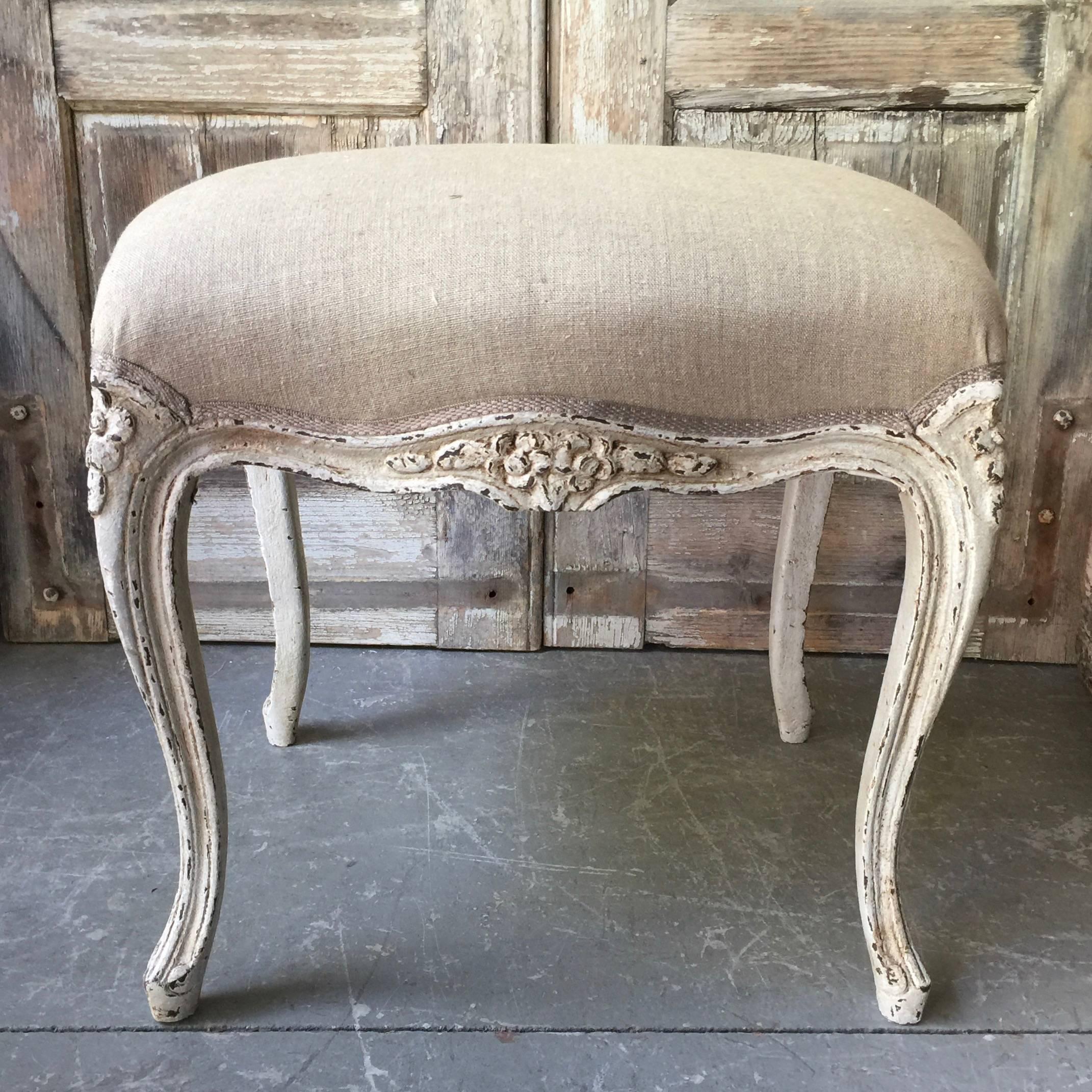 A painted footstool/bench in Louis XV style with scalloped frieze, raised on slender cabriole legs. Upholstered in linen with Classic gimp trim,
France, circa 1900.
Here are few examples … surprising pieces and objects, authentic, decorative and