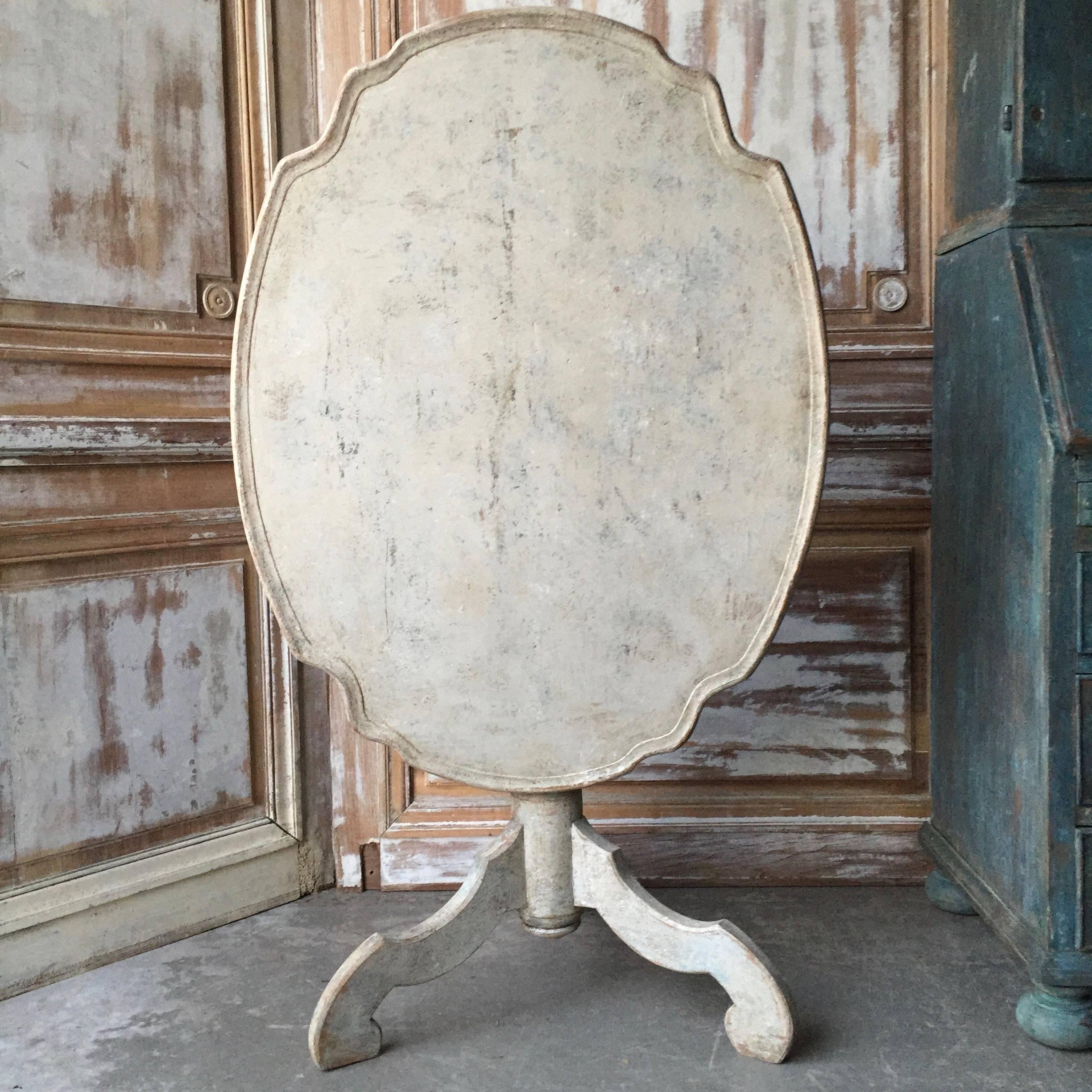 A large period Rococo oval, shaped top pedestal tray table, Sweden, circa 1760 with turned base supported by beautifully carved legs. Scrape back to traces of its original color. 
Stockhol, Sweden, circa 1760.
Here are few examples … surprising