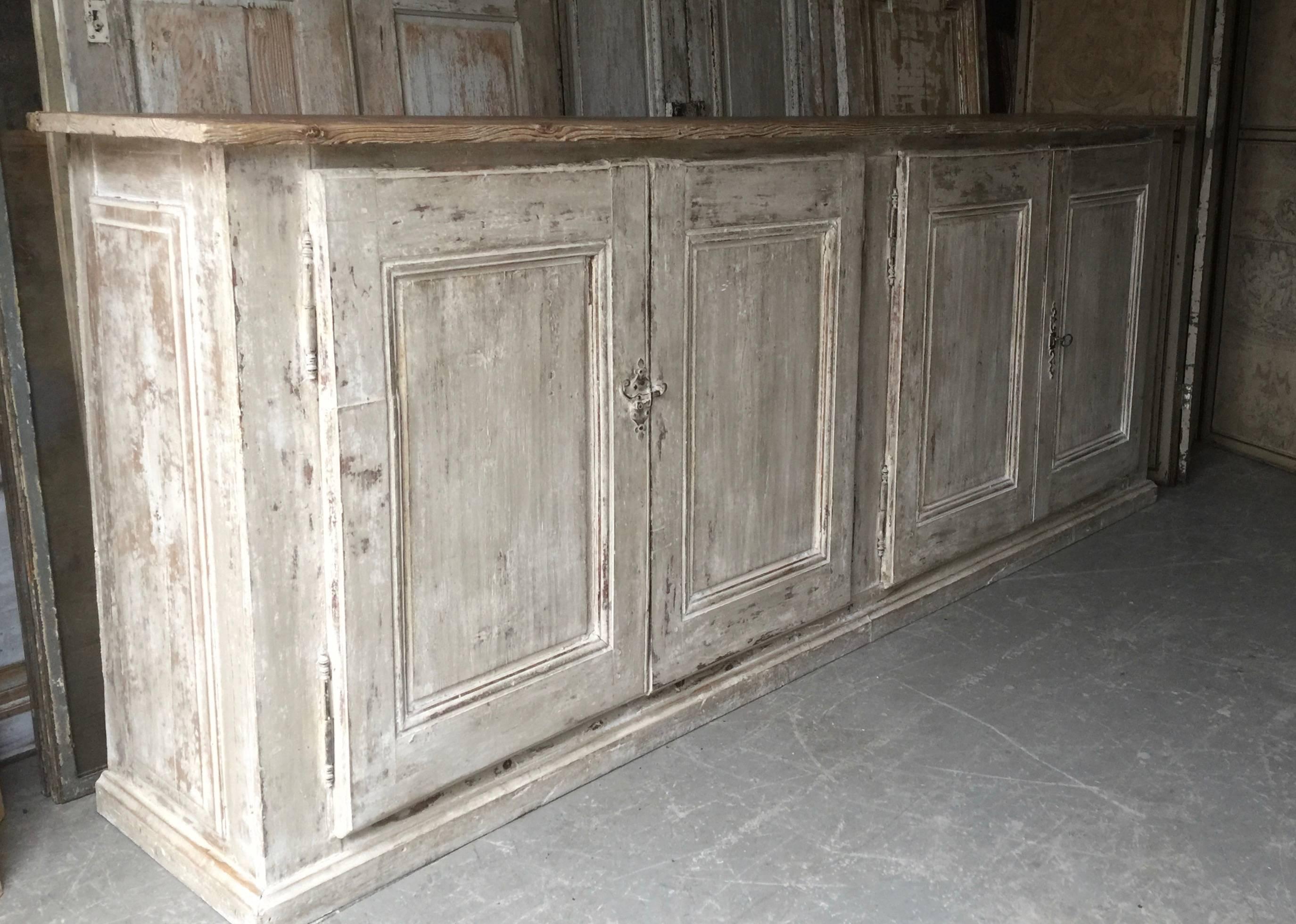 Huge, handsome 19th century painted French long enfilade or sideboard with four-panelled doors and sides with natural worn oak top,
France, early 19th century.
Here are few examples. Surprising pieces and objects, authentic, decorative and rare