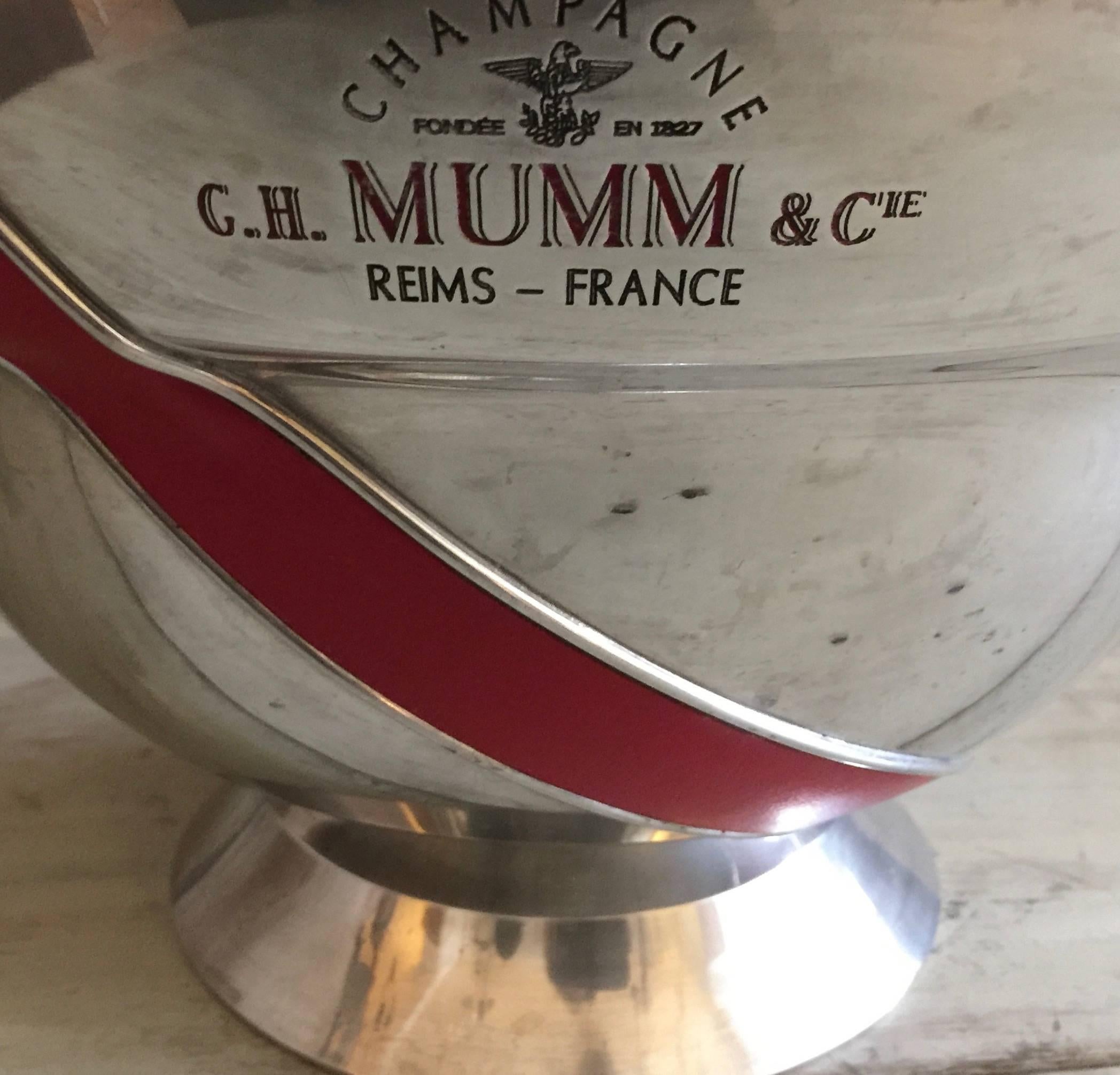 Vintage French champagne coolers from 1940-1950 in worn pewter, nickel or silver plate and feature the inscriptions along the sides 